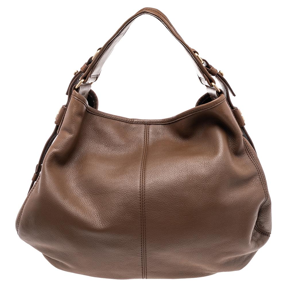Classic in design and easy to hold, this hobo from Givenchy is worth investing in. The hobo is crafted from leather and gold-tone hardware. The top opens to a spacious canvas-lined interior that can easily carry all your daily essentials.

