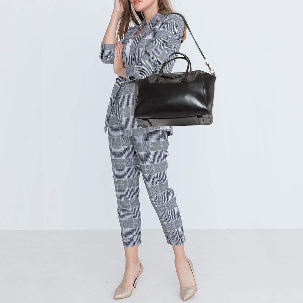 Marked by flawless craftsmanship and enduring appeal this Givenchy satchel is bound to be a versatile and durable accessory. It has a spacious size.