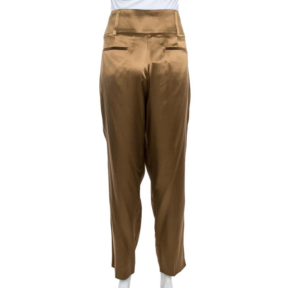 Stylish, sophisticated, and smart, these trousers from Givenchy are absolute must-haves. Crafted from 100% silk, these luxurious trousers come in a lovely shade of brown. They are styled with zip closure, four pockets, pleat detailing and belt