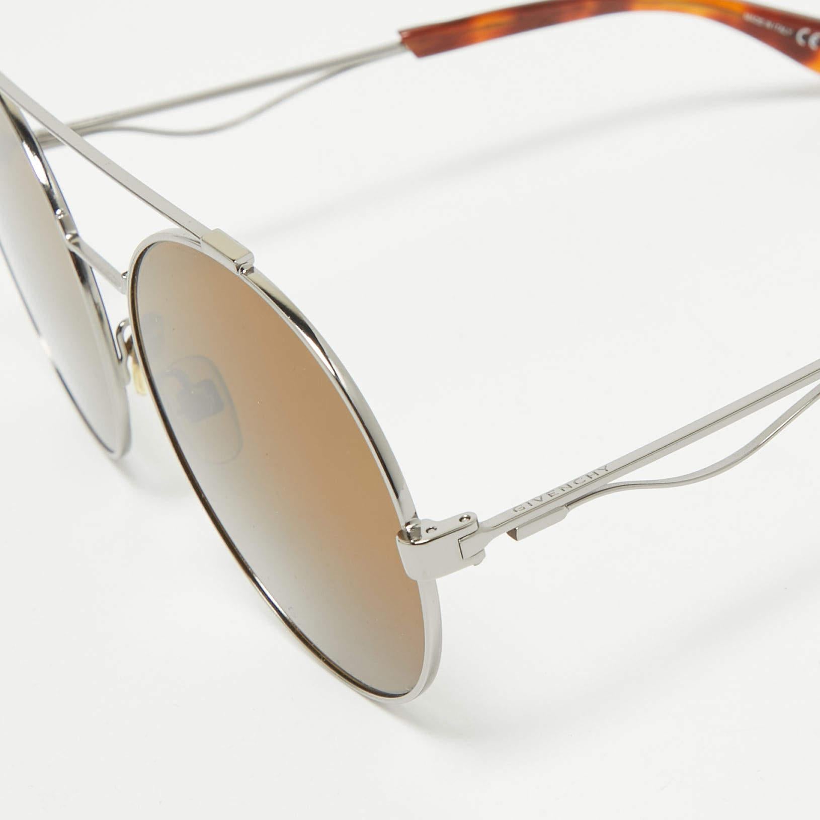 Embrace sunny days in full style with these chic sunglasses by Givenchy. Created with expertise they feature a sleek frame and high quality lenses that are equipped to protect your eyes.