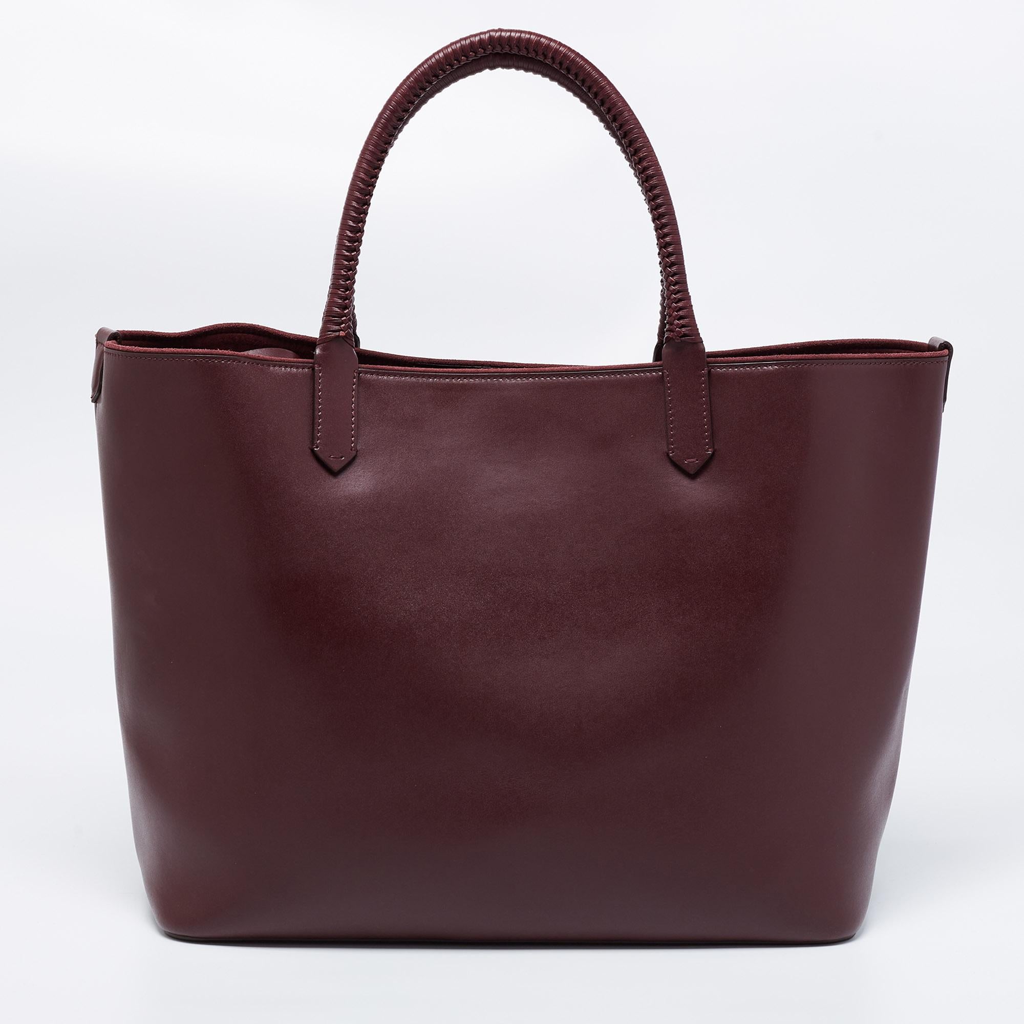 Givenchy's Antigona Belt tote has a modern silhouette and a functional quality. Constructed using leather, the bag has a front logo and a suede-lined interior. The whipstitch handles on the top of the bag act as the design's highlight.

Includes: