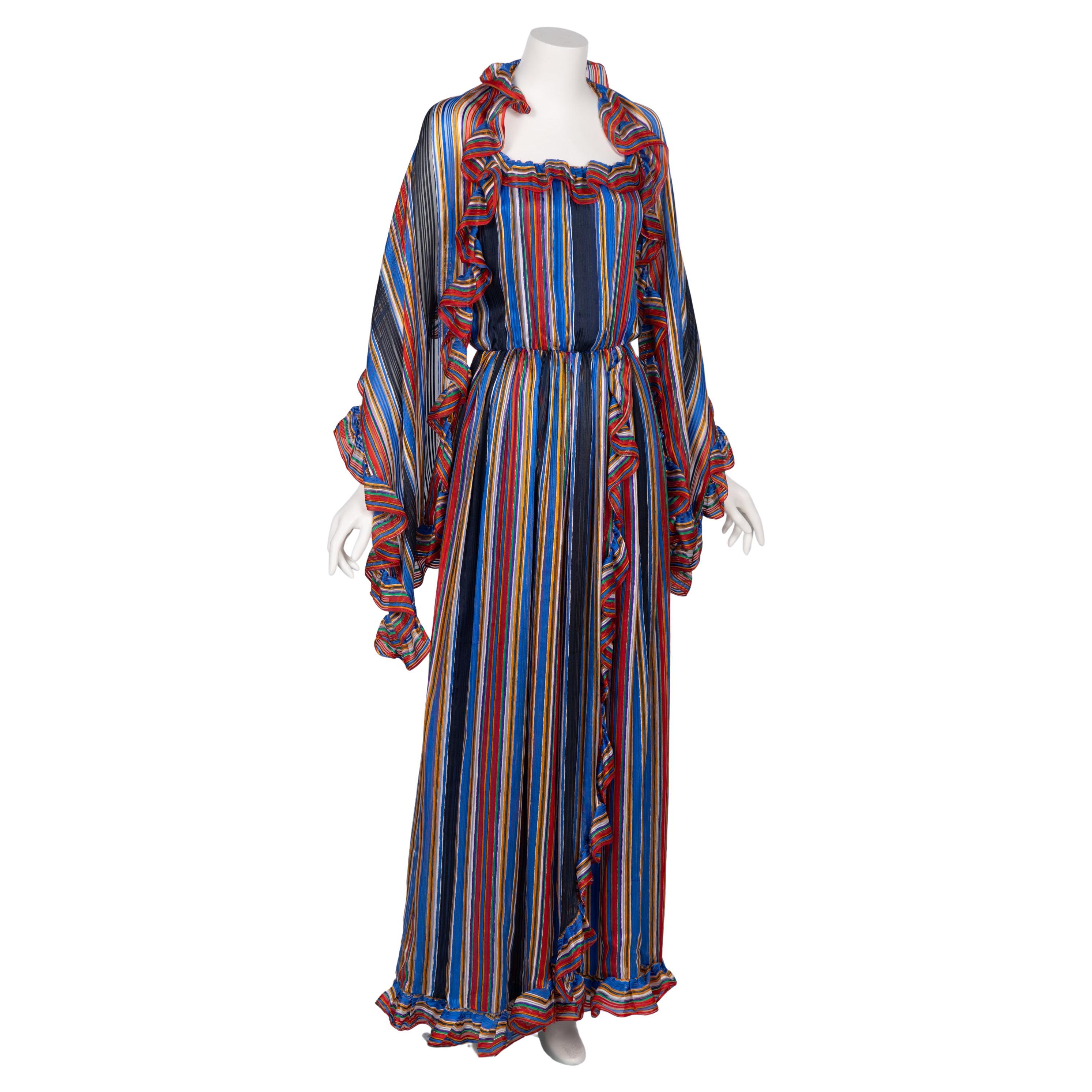 Vintage Givenchy Nouvelle Boutique Robe à volants en mousseline rayée - 1970

Cet ensemble vintage Givenchy est une célébration radieuse de la couleur, du mouvement et du glamour des années 1970. Confectionné en mousseline de soie légère comme une
