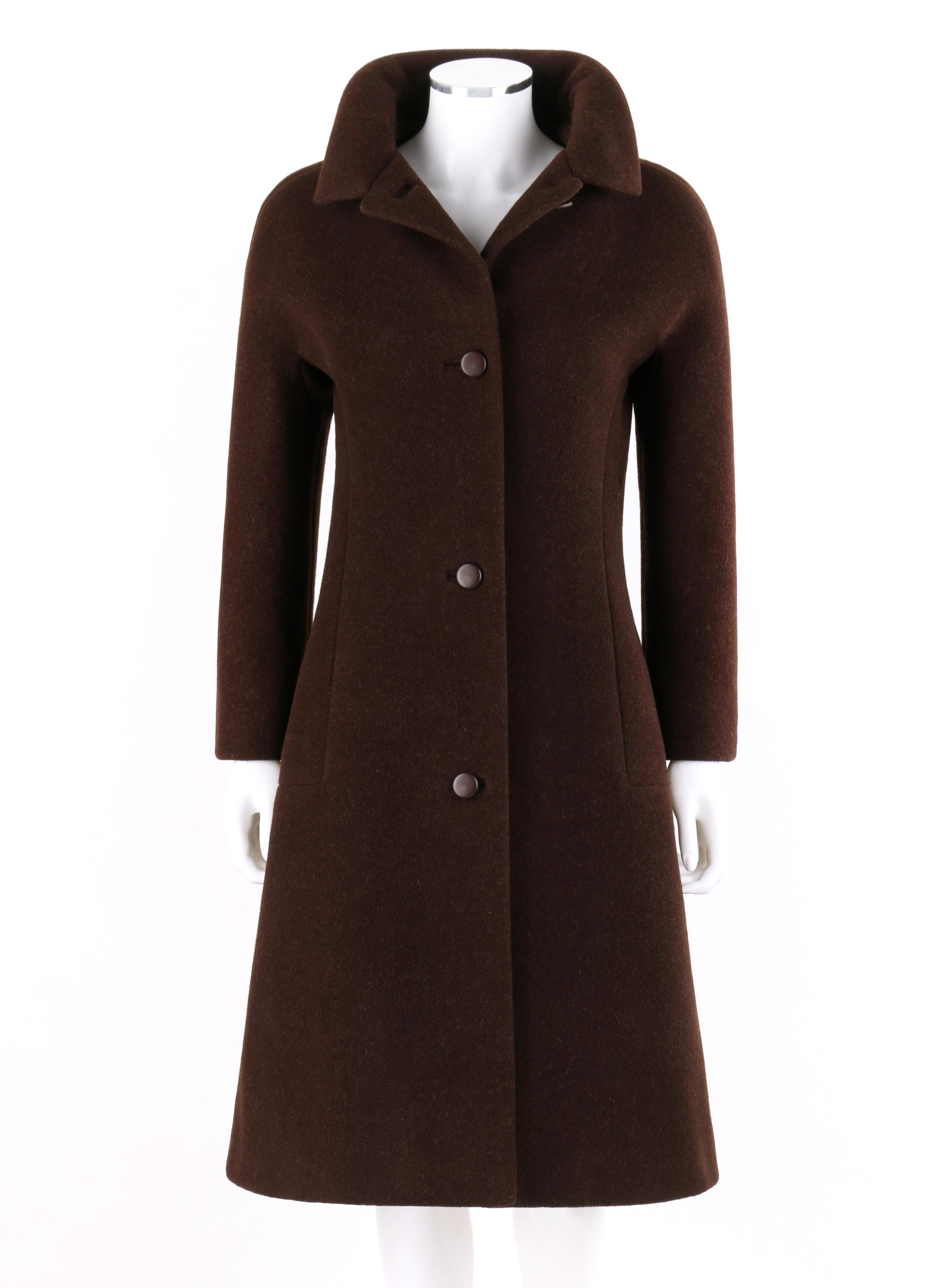 GIVENCHY c. 1960’s Early Haute Couture Dark Brown Wool Princess Coat Jacket 

Circa: 1960’s 
Label(s): Givenchy 
Style: Princess Coat
Color(s): Brown
Lined: Yes 
Unmarked Fabric Content (feel of): Exterior: Wool blend. Lining: Silk
Additional