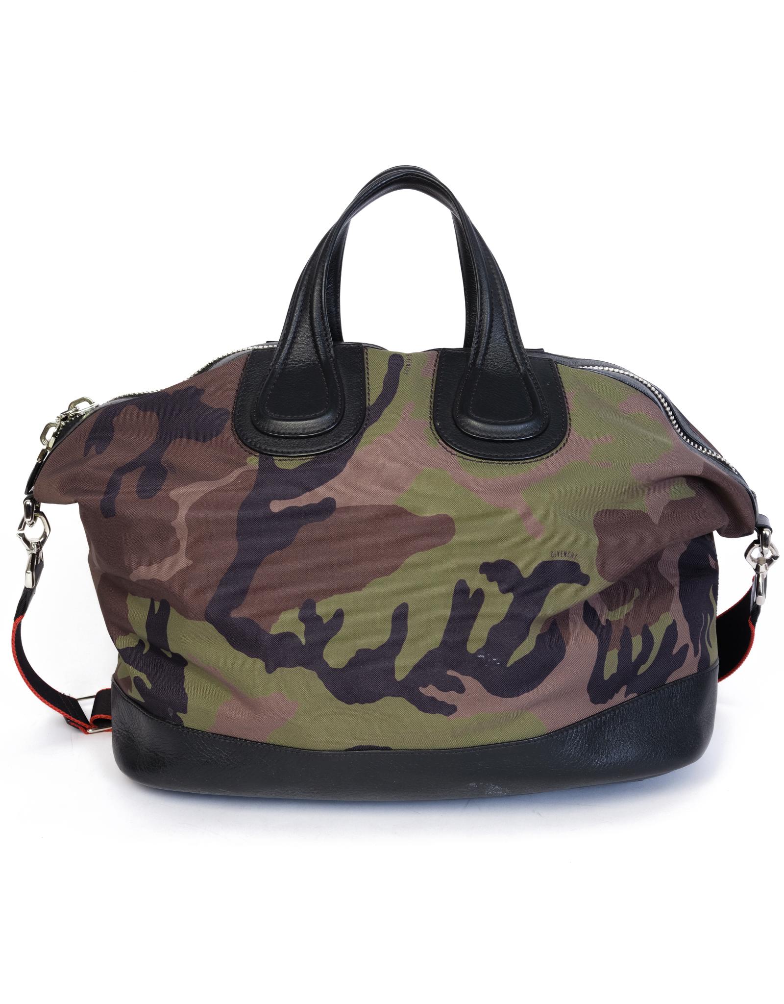 Nylon tote featuring camouflage pattern in tones of black, brown & green. Black faux-leather trim throughout. Twin carry handles at top & branded adjustable crossbody strap.

COLOR: Camo
MATERIAL: Nylon with leather finishes
ITEM CODE: MAD