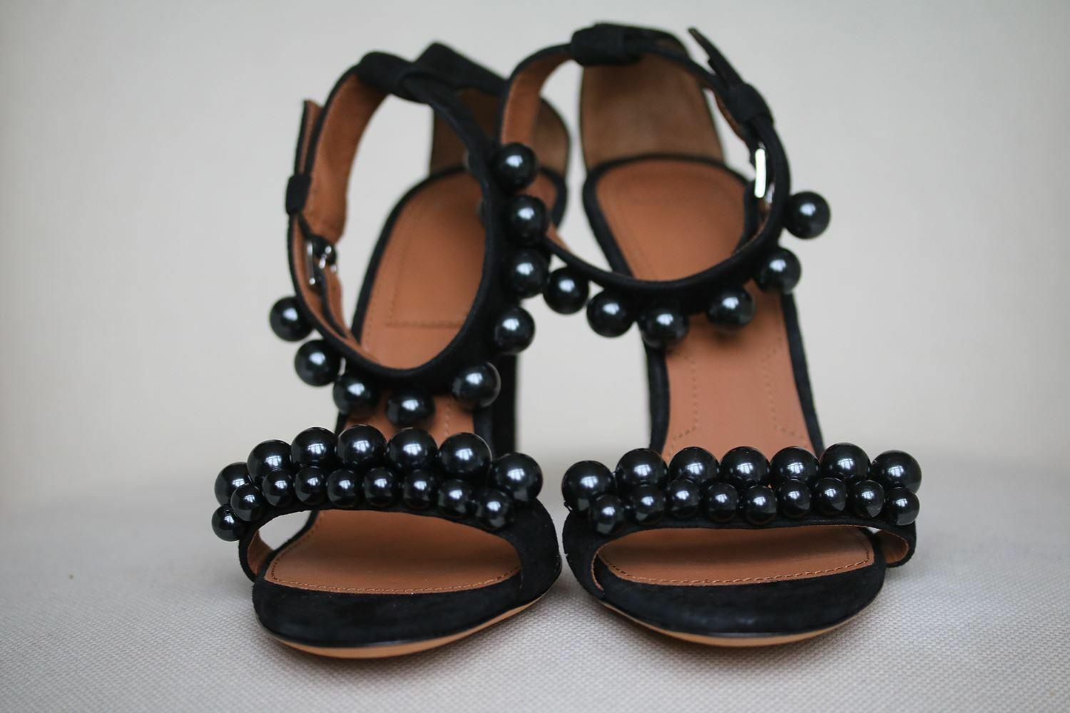 Aptly named 'Classic Line', Givenchy's sandals have a minimalist silhouette and slim stiletto heel.
They're made from supple black suede and adorned with oversized polished beads.
Heel measures approximately 100mm/ 4 inches. 
Black suede. 
Black