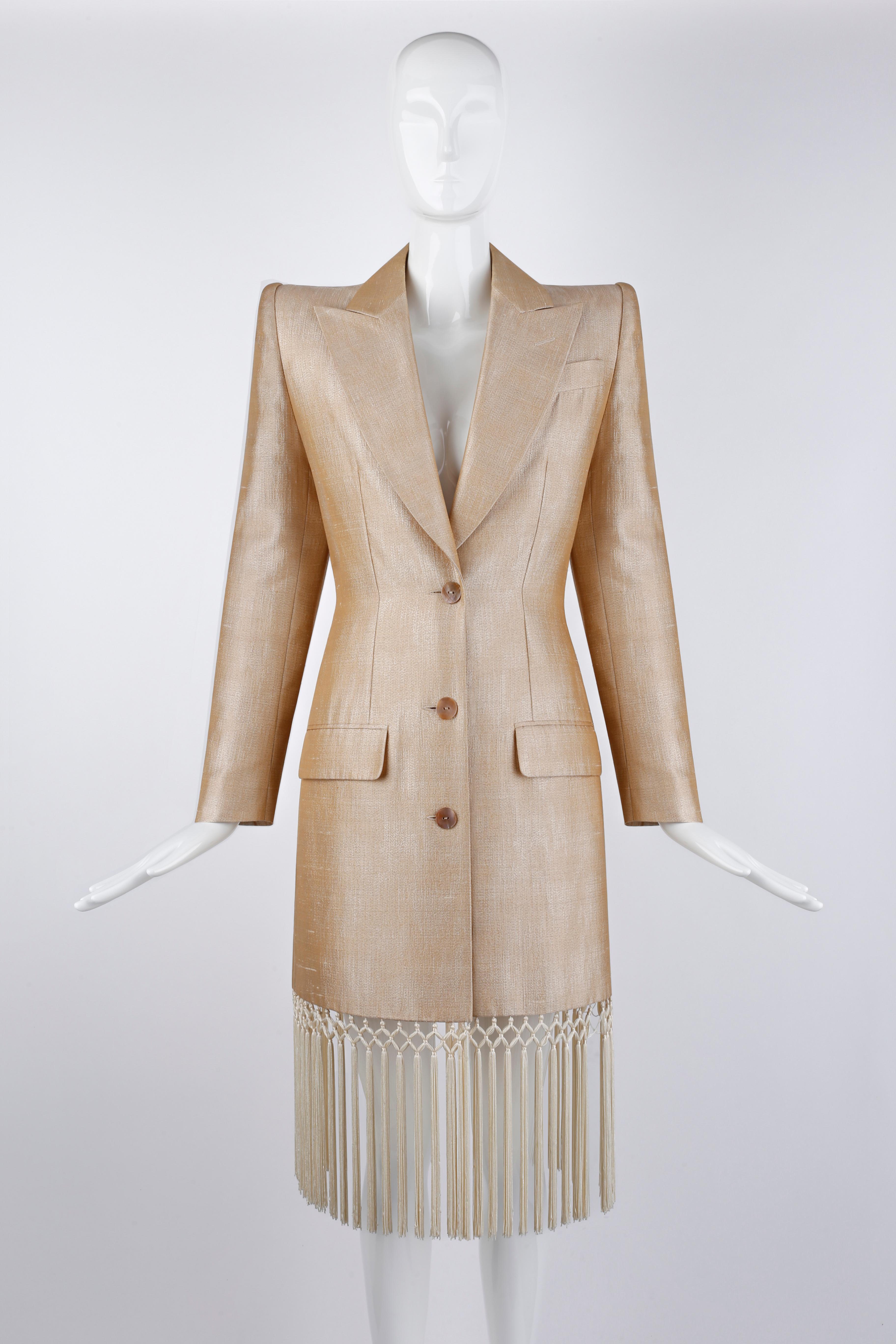Designed by Alexander McQueen for the Givenchy Couture Spring/Summer 1998 collection. This rare dress coat features numerous tassels adorned along the entire hemline. Structured shoulders and tailored fit. Silk blend material allows for a beautiful