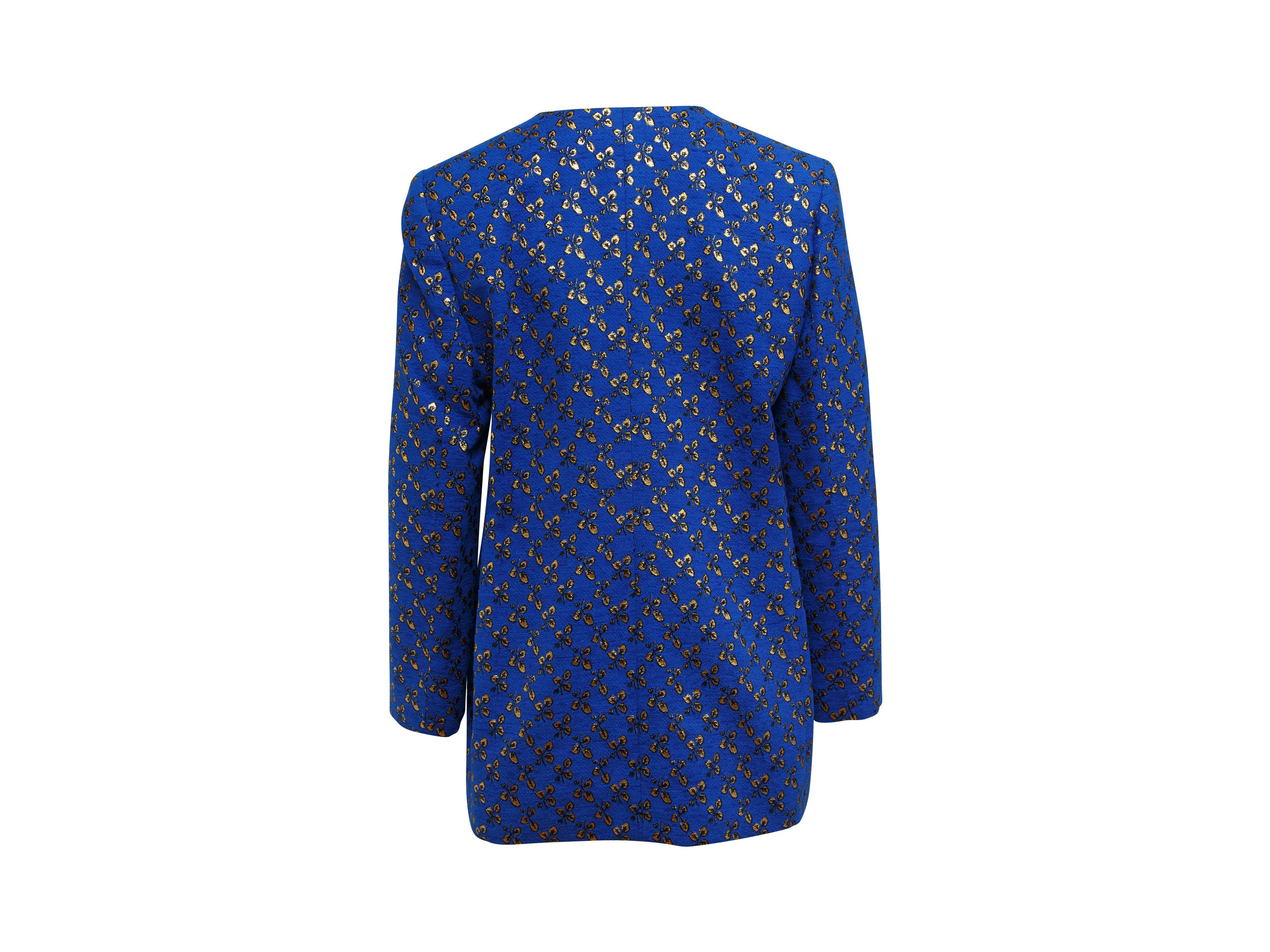 Product details:  Vintage metallic gold and blue leaf-printed jacket by Givenchy Couture.  V-neck.  Long sleeves.  Button-front closure.  Goldtone hardware.  40