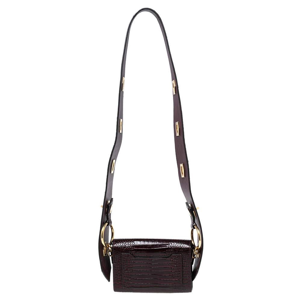 Givenchy's Nano Eden shoulder bag in dark burgundy is constructed using croc-embossed leather and highlighted by a gleaming logo detail at the front. The compact bag is held by an adjustable shoulder strap.

Includes: Original Dustbag, Detachable