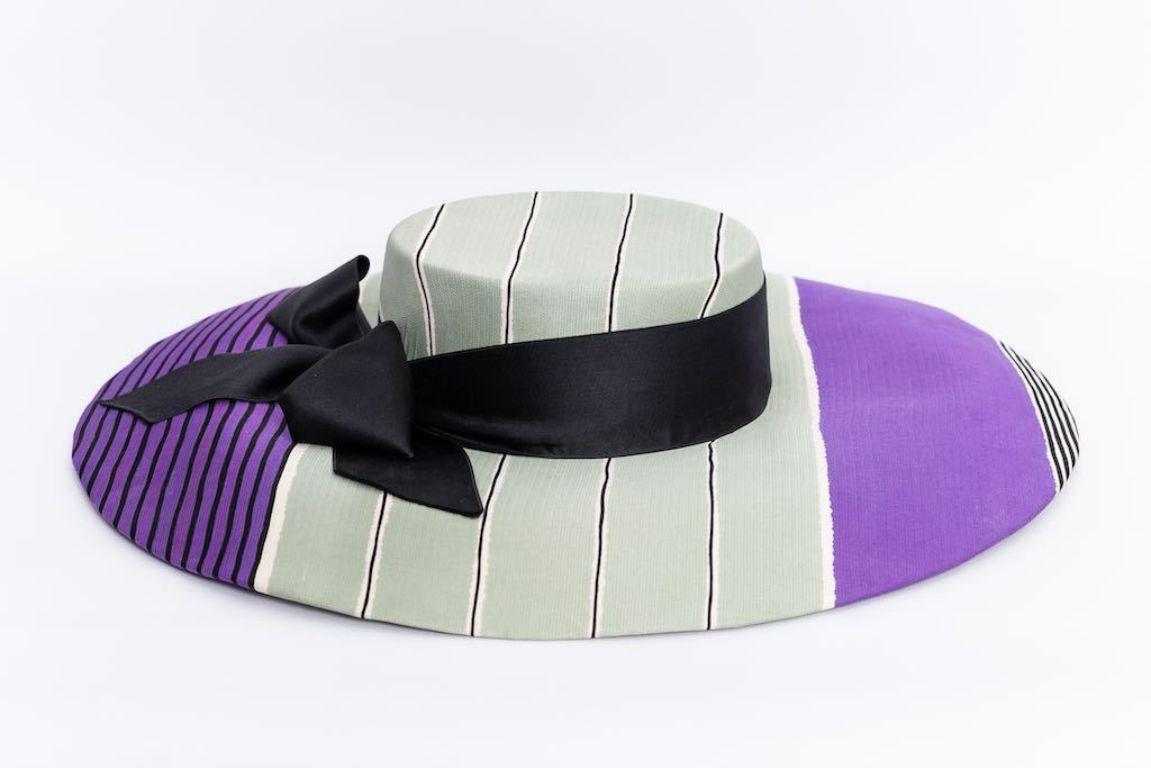 Givenchy (Made in France) Wide brim hat composed of striped silk in sea-green, purple, black and white colors, decorated with a black ribbon.

Additional information: 
Dimensions: Head circumference: 52 cm (20.47 in) - Height: 8 cm (3.15 in) - Brim: