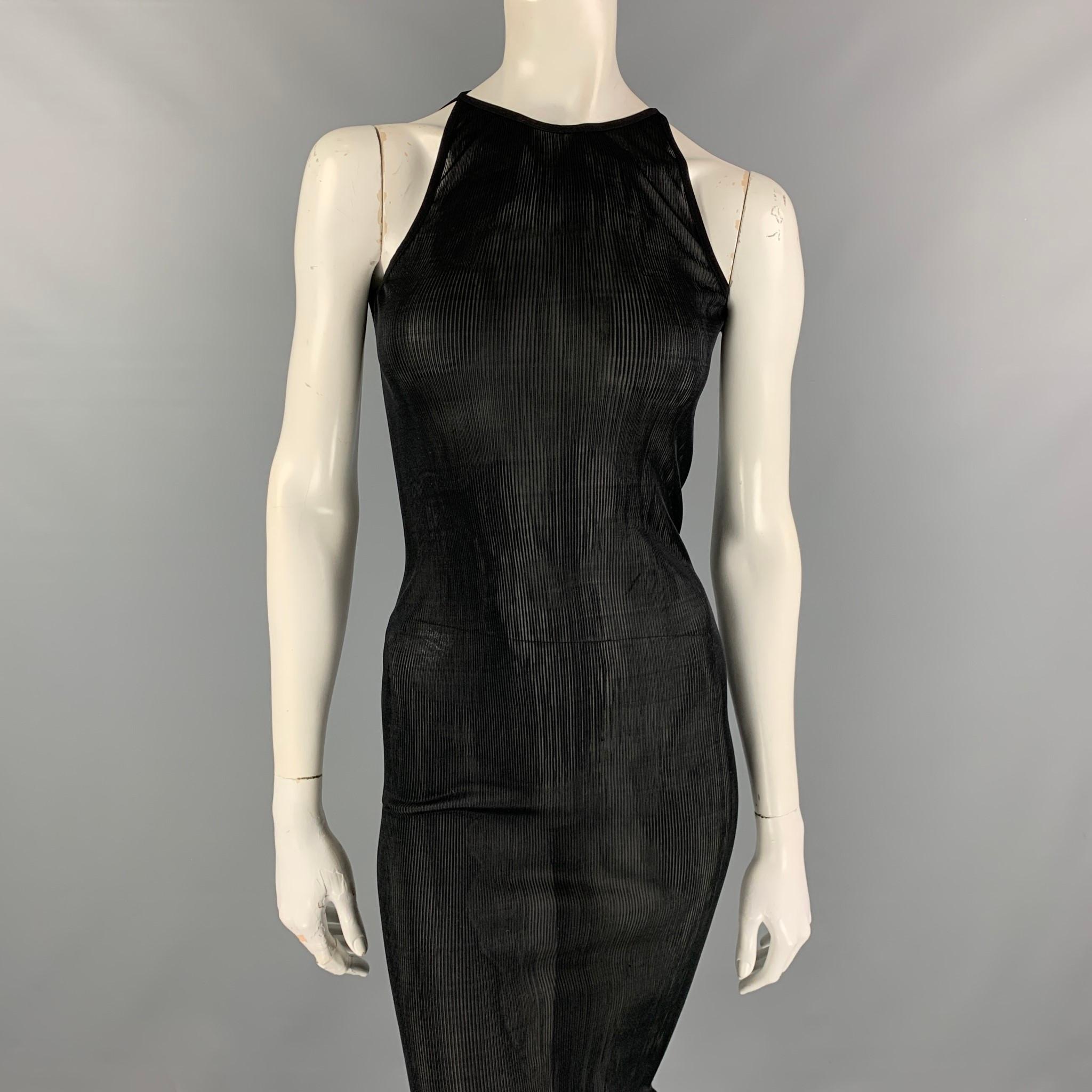 GIVENCHY maxi dress comes in a black sheer ribbed silk featuring a high neckline and a button-fastening keyhole at back. Comfortably fits those are between a size XS-M. who Made in Italy. 

New Without Tags. 
Marked: TU
Original Retail Price: