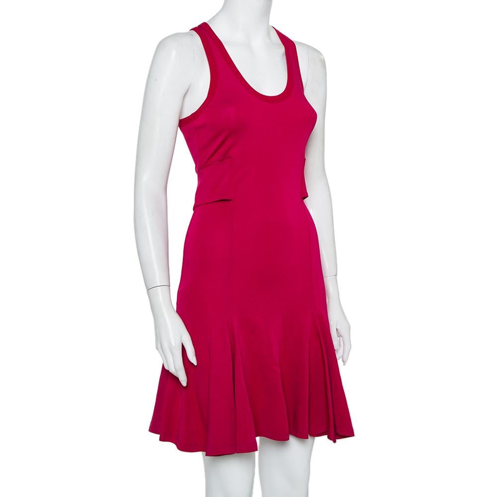 This stylish dress hails from the house of Givenchy. Crafted from a quality jersey fabric, it carries a lovely shade of fuchsia pink. It flaunts a sleeveless style, a round neckline, and a fit and flare silhouette. You can pair it with flats as well