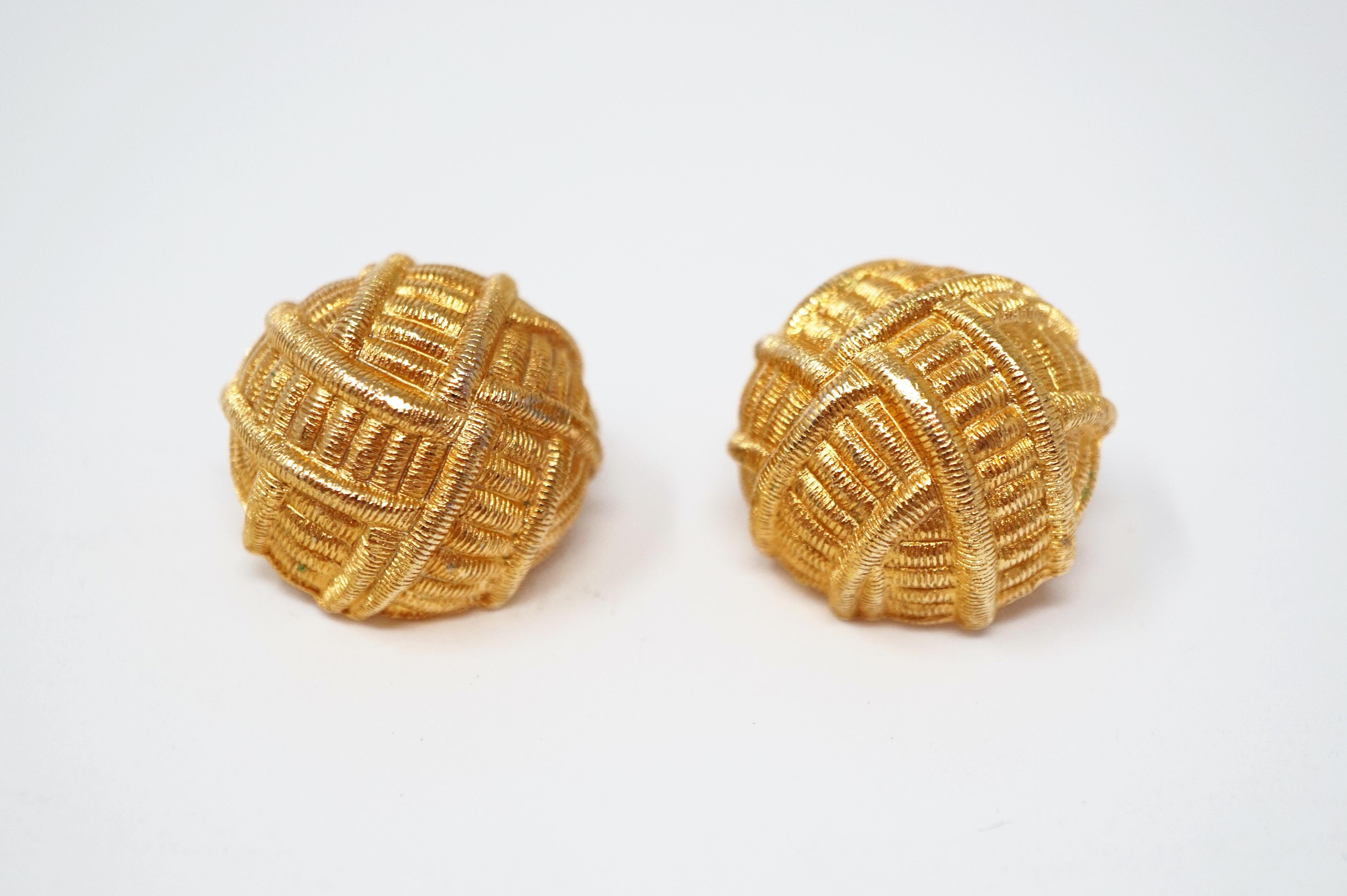 These gorgeous gilded clip-on dome statement earrings by Givenchy make a bold statement with a beautiful shiny gold luster. An excellent example of Givenchy's 80s style and a wonderful addition to your vintage jewelry collection.

Givenchy is a