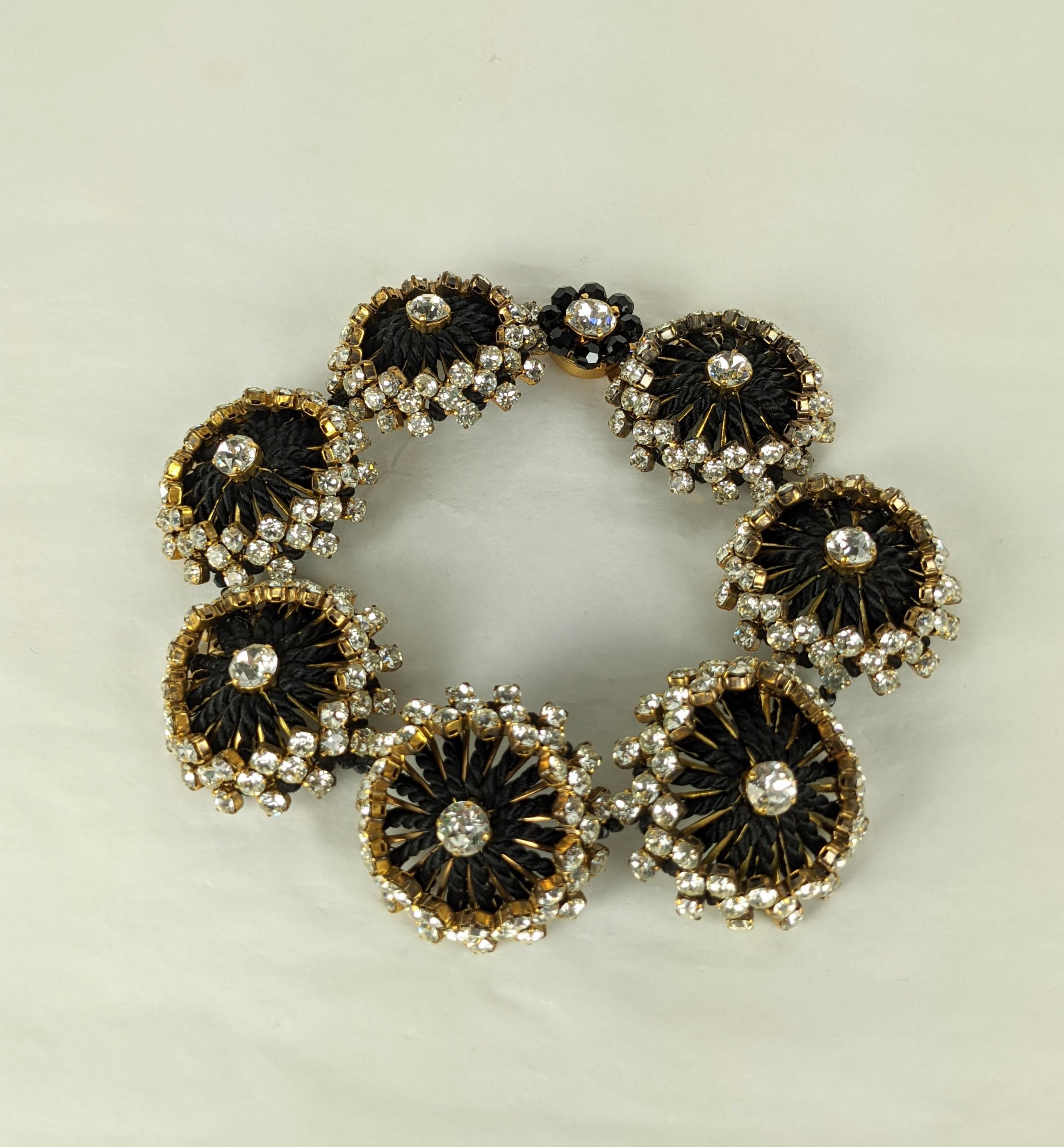 Hubert de Givenchy Haute Couture gilt flower head passementerie choker from the estate of Bunny Mellon. The large flower head links composed of crystal rhinestone set gilt metal stamens enhanced by black silk twisted passementerie cording.  Faceted