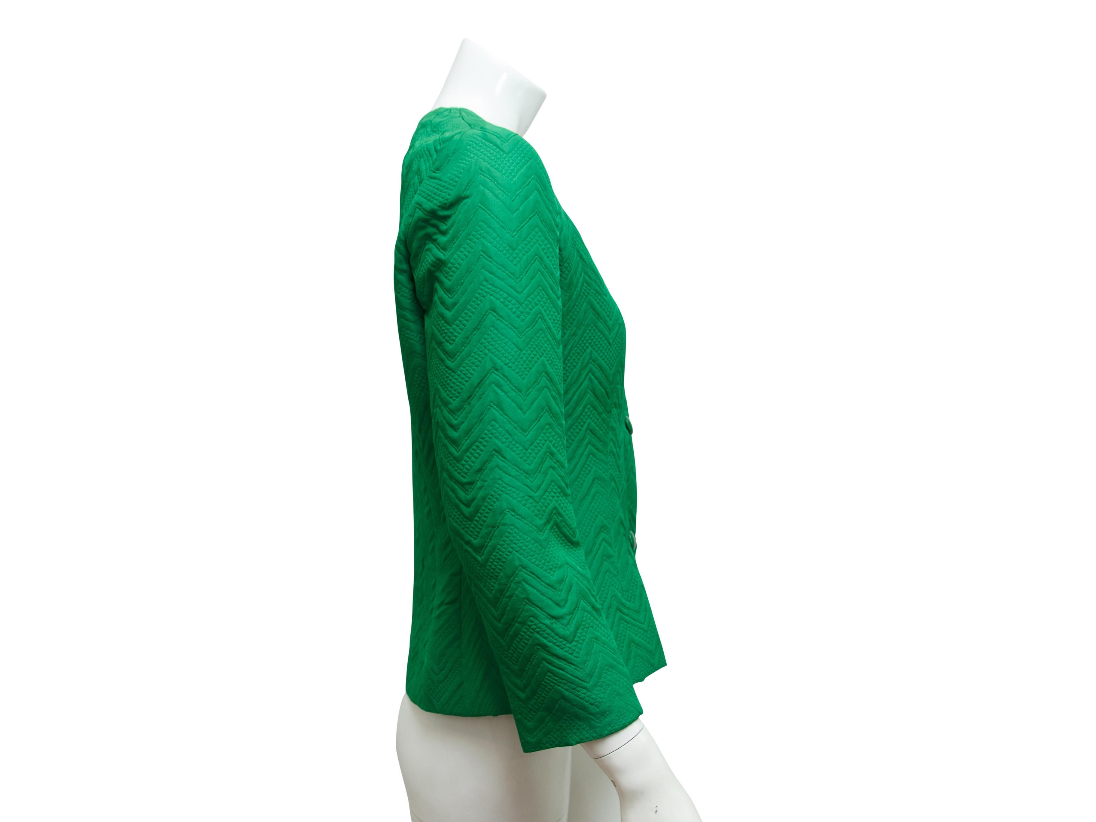 Product details:  Vintage green wool-blend chevron jacket by Givenchy.  V-neck.  Bracelet-length sleeves.  Button-front closure.  34