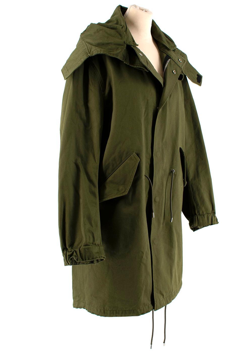 Givenchy Green Cotton Wings Print Parka Coat

- Made of soft Cotton 
- Gorgeous wings print to the back 
- Leather details
- Pockets to the front 
- Gorgeous green hue 
- Elasticated buttoned cuffs 
- Adjustable string fastening to the waist 
-