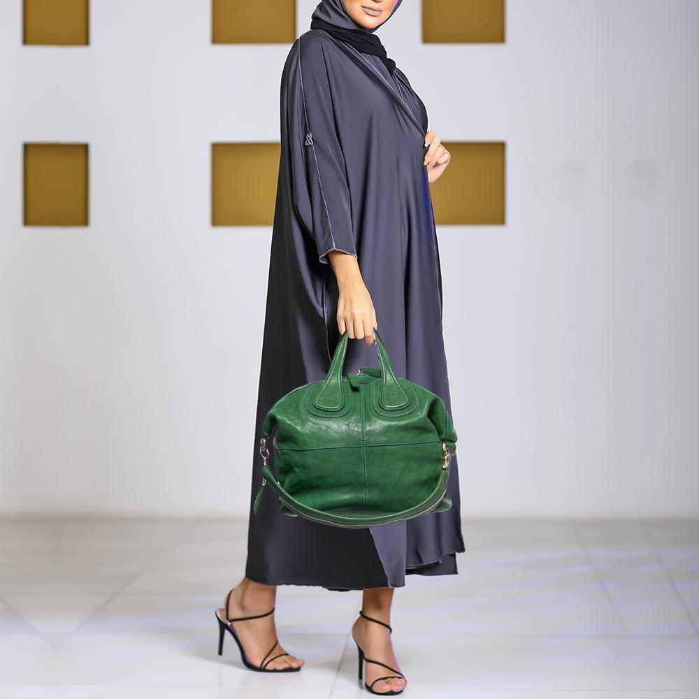 Excellently crafted from green leather for a classy touch, this Nightingale bag from Givenchy is a creation that is ideal for daily use and on your travels. It features two top handles, a shoulder strap, and a spacious interior to hold your