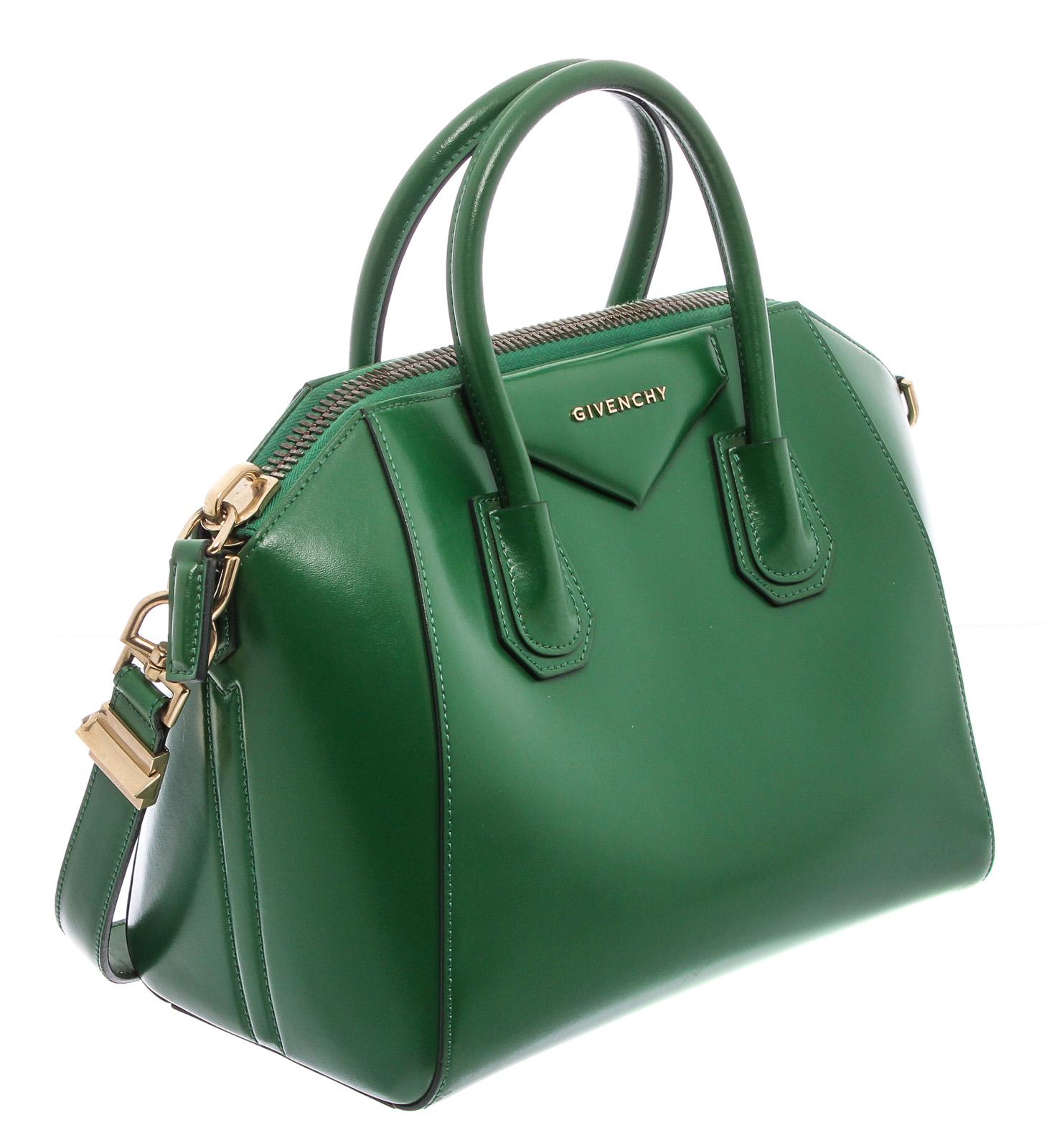 Green leather Givenchy Small Antigona satchel with silver-tone hardware, dual rolled top handles, detachable flat shoulder strap, logo adornment at front, black woven lining, three pockets at interior walls; one with zip closure and zip closure at