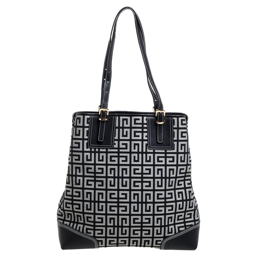 This admirable Givenchy tote is matchless beauty. Made from monogram canvas, it features leather trims on the edges and dual handles. Made in France, the bag has a spacious nylon-lined interior to store your everyday essentials. This is an ideal