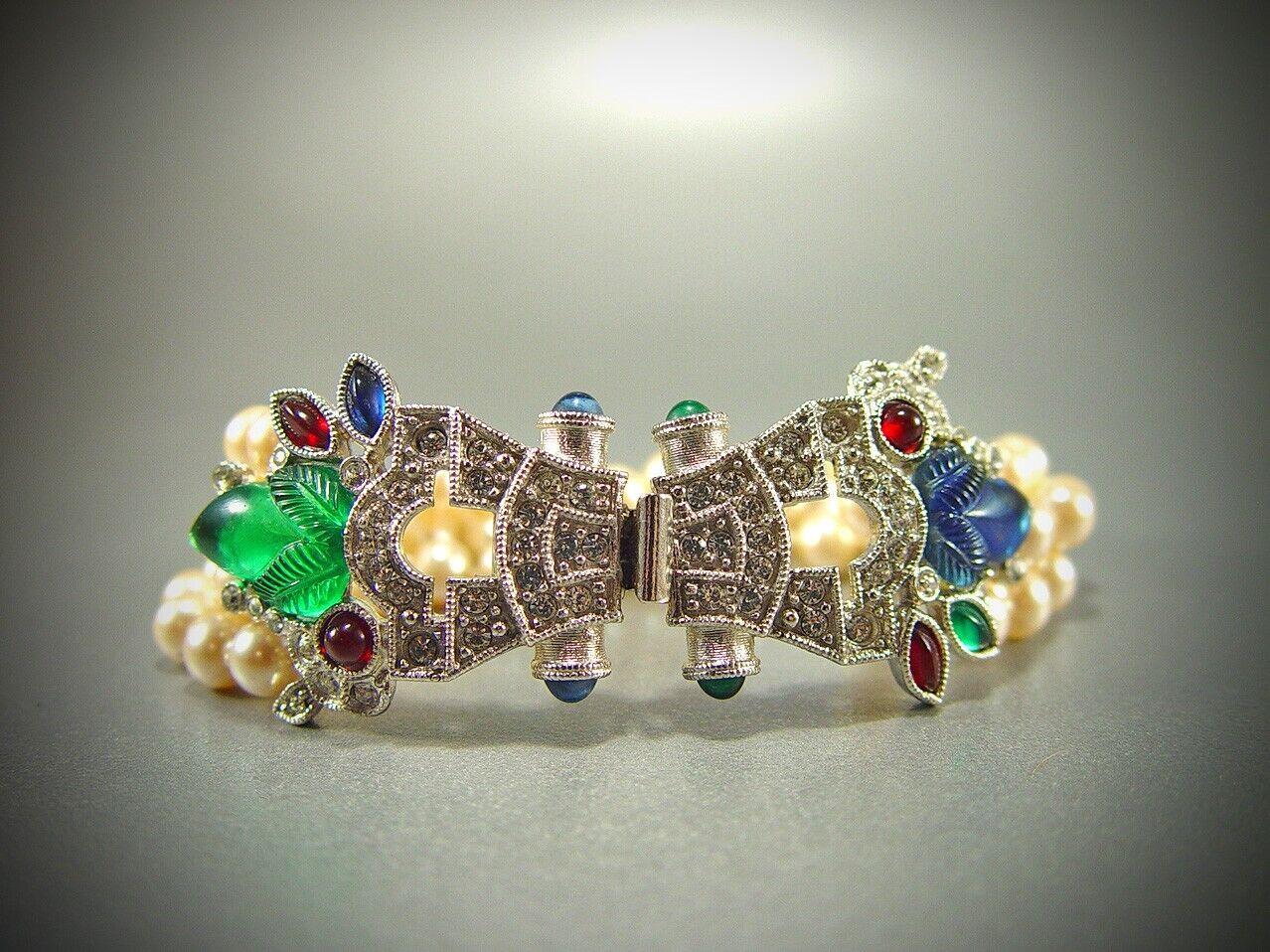 Simply Beautiful! Rare signed Givenchy Tutti Frutti and Faux Pearl Haute Couture Bracelet.The brilliant primary colors of the glass elements are set off beautifully by the pave set paste stones and creamy hand-knotted glass pearls. Such a rich