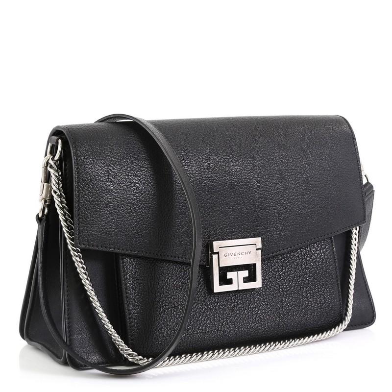 This Givenchy GV3 Flap Bag Leather Medium, crafted in black quilted leather, features removable chain and leather shoulder strap, flap top with logo-engraved flip-lock closure, exterior front zip and slip compartments and silver-tone hardware. Its