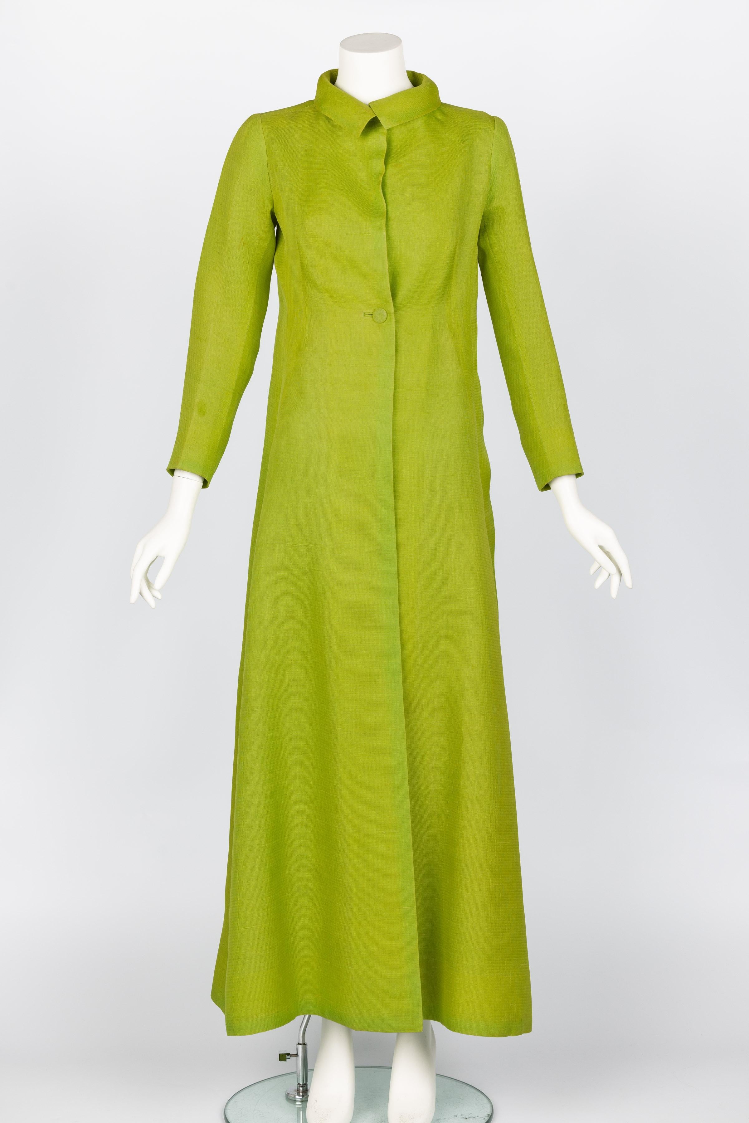 This vintage Givenchy numbered haute couture silk evening coat is from the Spring 1971/72 collection. Crafted from textured silk in a striking chartreuse green, the coat showcases the impeccable craftsmanship of the era. The textured fabric adds
