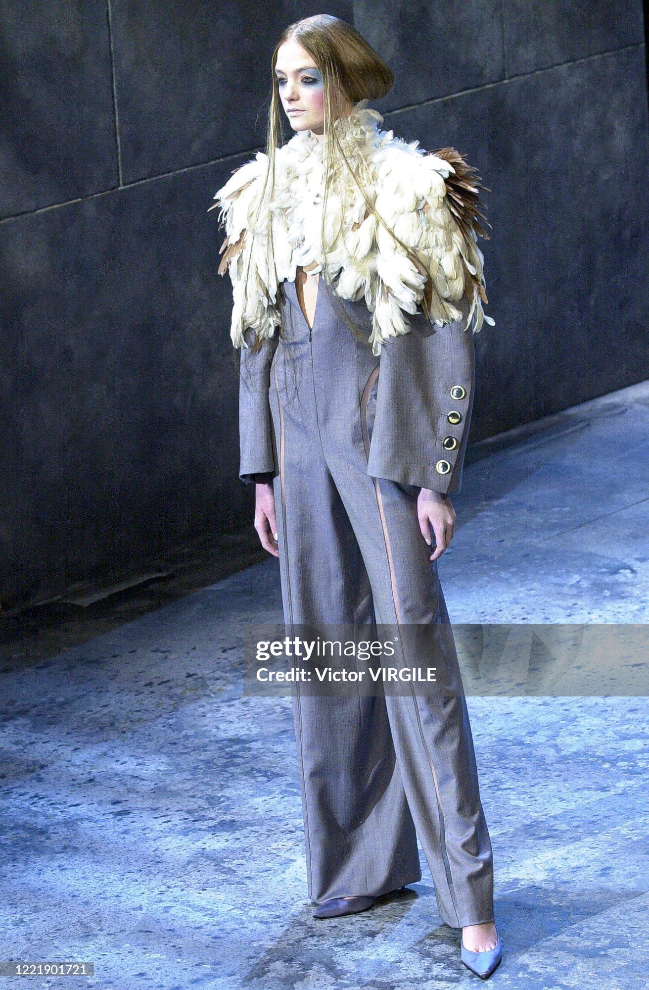 Givenchy Haute Couture 
by Alexander McQueen
Spring 2000 - very similar version seen on the runway. Our one is made to order for a customer, so very likely to be one of a kind.

Grey lightweight wool jumpsuit with mesh inserts
Deep V neckline with