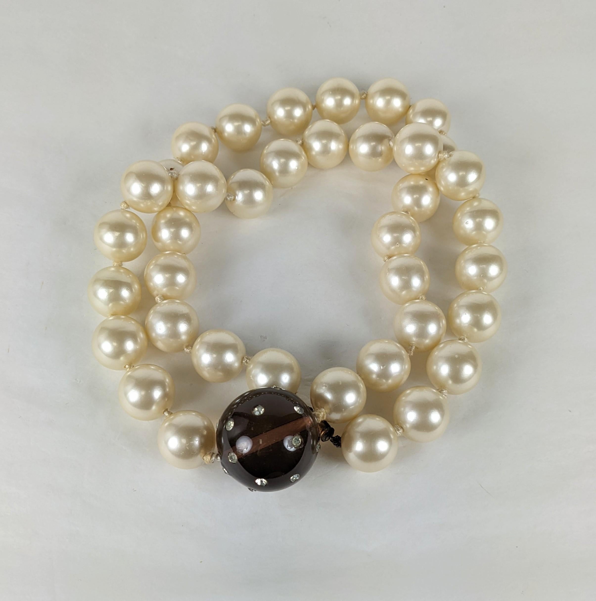 Hubert de Givenchy Haute Couture opera length necklace from the estate of Bunny Mellon. Composed of signature Maison Gripoix handmade  large faux pearls with a very large focal center smokey Gripoix handmade glass bead set with scattered crystal