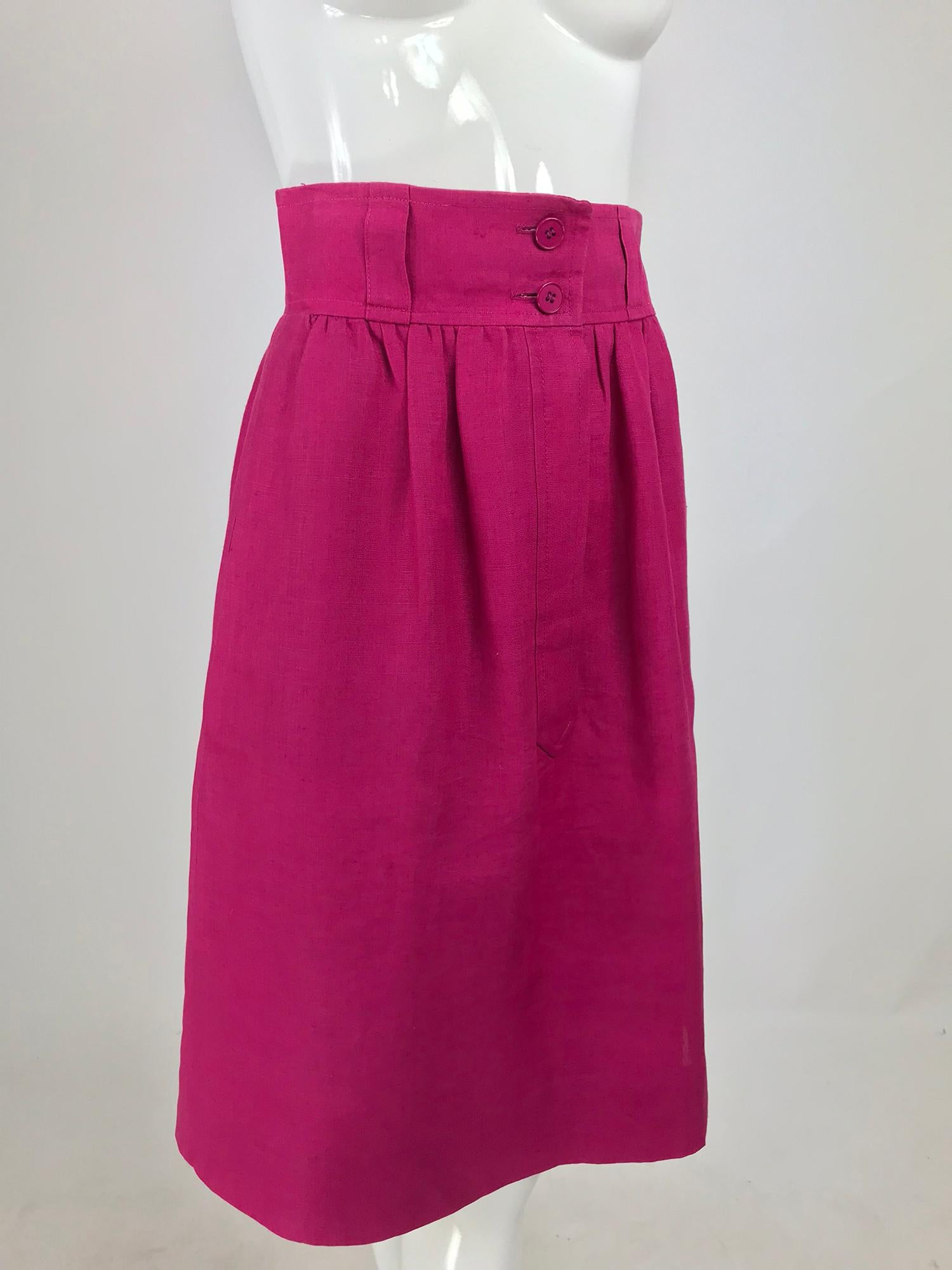 Givenchy Hot Pink Linen Skirt from the 1980s. Wide high waist skirt has double button closure at the front and narrow belt loops around at the waist band center. There is a placket at the center front with a hidden buttons below. On seam side