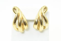 Große goldfarbene stilisierte Creolen mit offenem Wirbelband von Givenchy