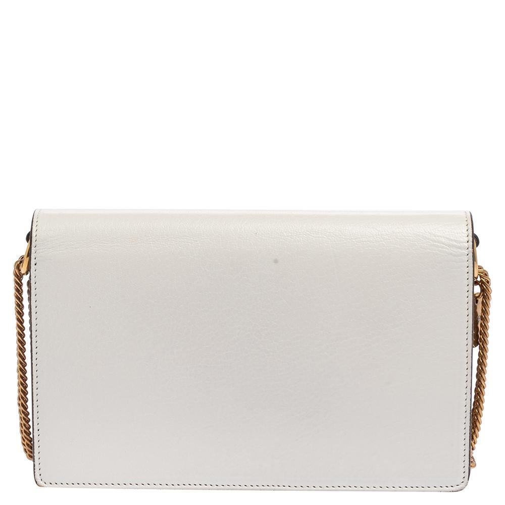 Complete a stylish look with this lovely Givenchy Mini GV3 bag. It comes carefully crafted using leather as well as suede and is designed with a logo lock at the front to secure the fabric interior. This crossbody bag is completed with a gold-tone