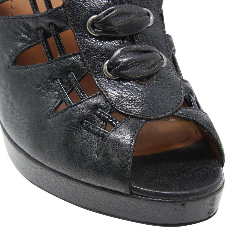 Givenchy Leather Peep Toe Lace Up Platform Booties Size 39.5 GV-S0929P-0323

These sexy heels by Givenchy will give any outfit an edgy update. Featuring black leather, these sandals have a strappy cage-style upper with grommets that give off a lace