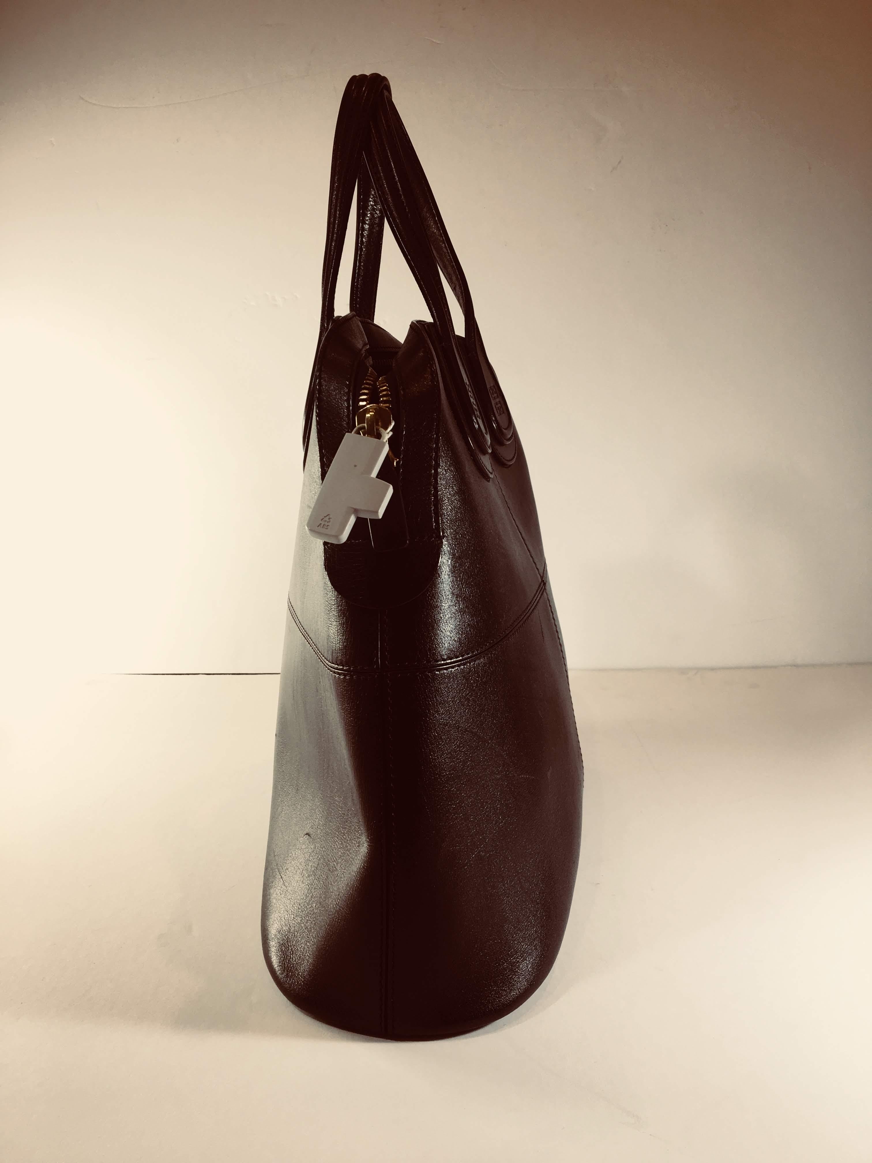 Black Leather Tote Bag with Gold Studs on Bottom 
15.50