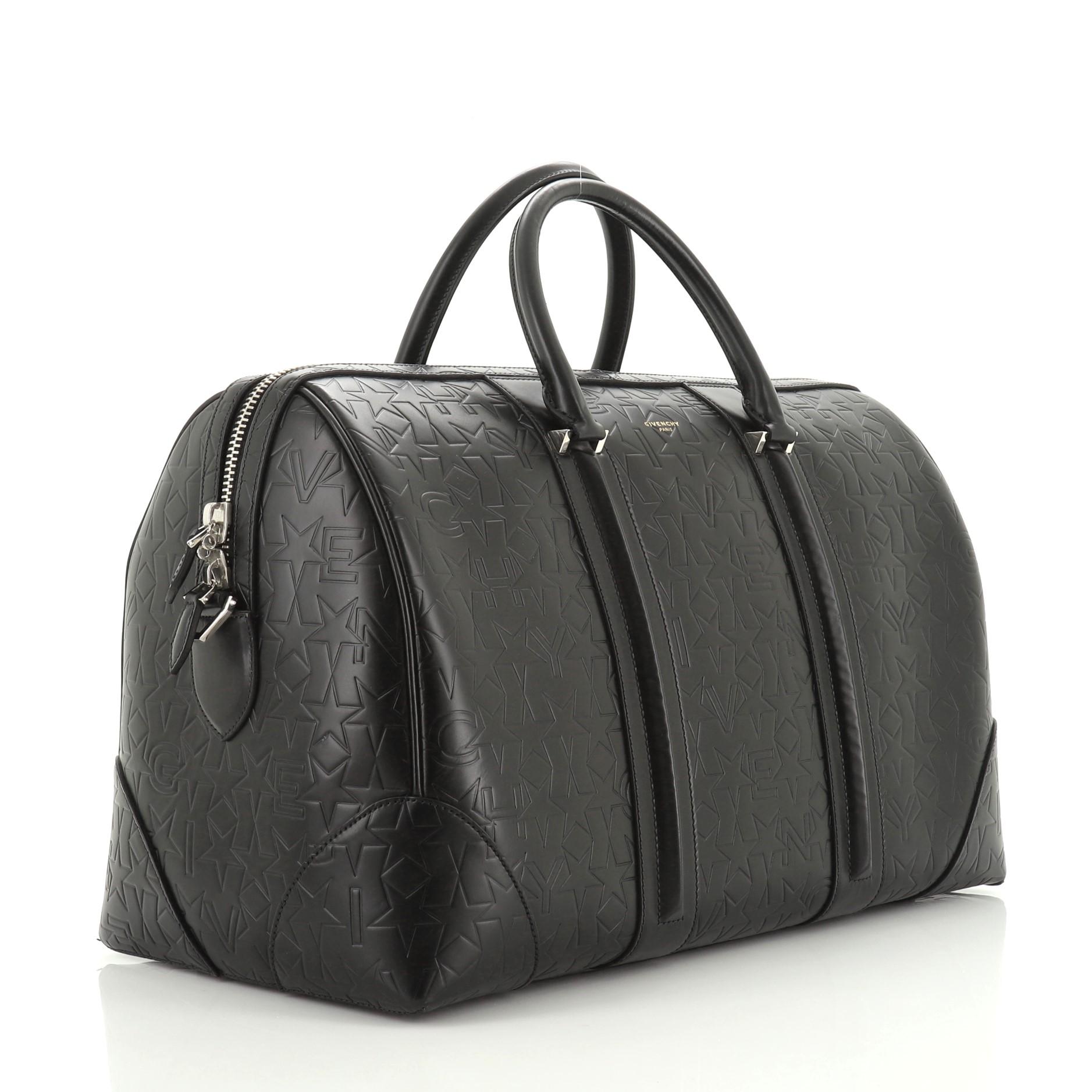 This Givenchy Lucrezia Travel Bag Embossed Leather, crafted from black embossed leather, features dual rolled leather handles and silver-tone hardware. Its zip closure opens to a black fabric interior with side slip pocket. 

Estimated Retail Price:
