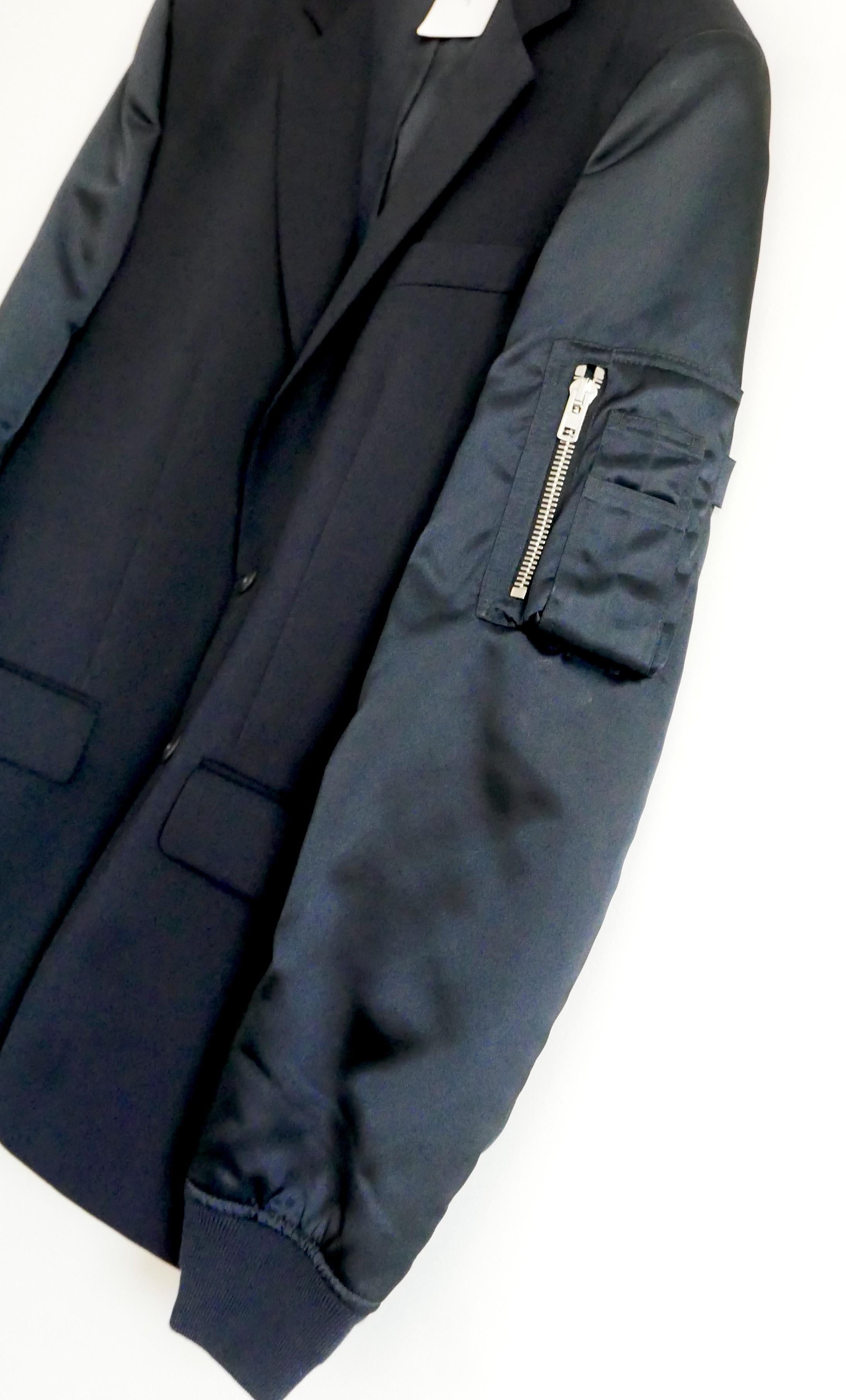 Super cool blazer meets bomber jacket from Givenchy. bought for £2950 and unworn with all tags. 
Has a classic smooth navy wool tailored blazer body with lined button fastening, strong shoulders, 3 buttons and signature cross
darting to back of
