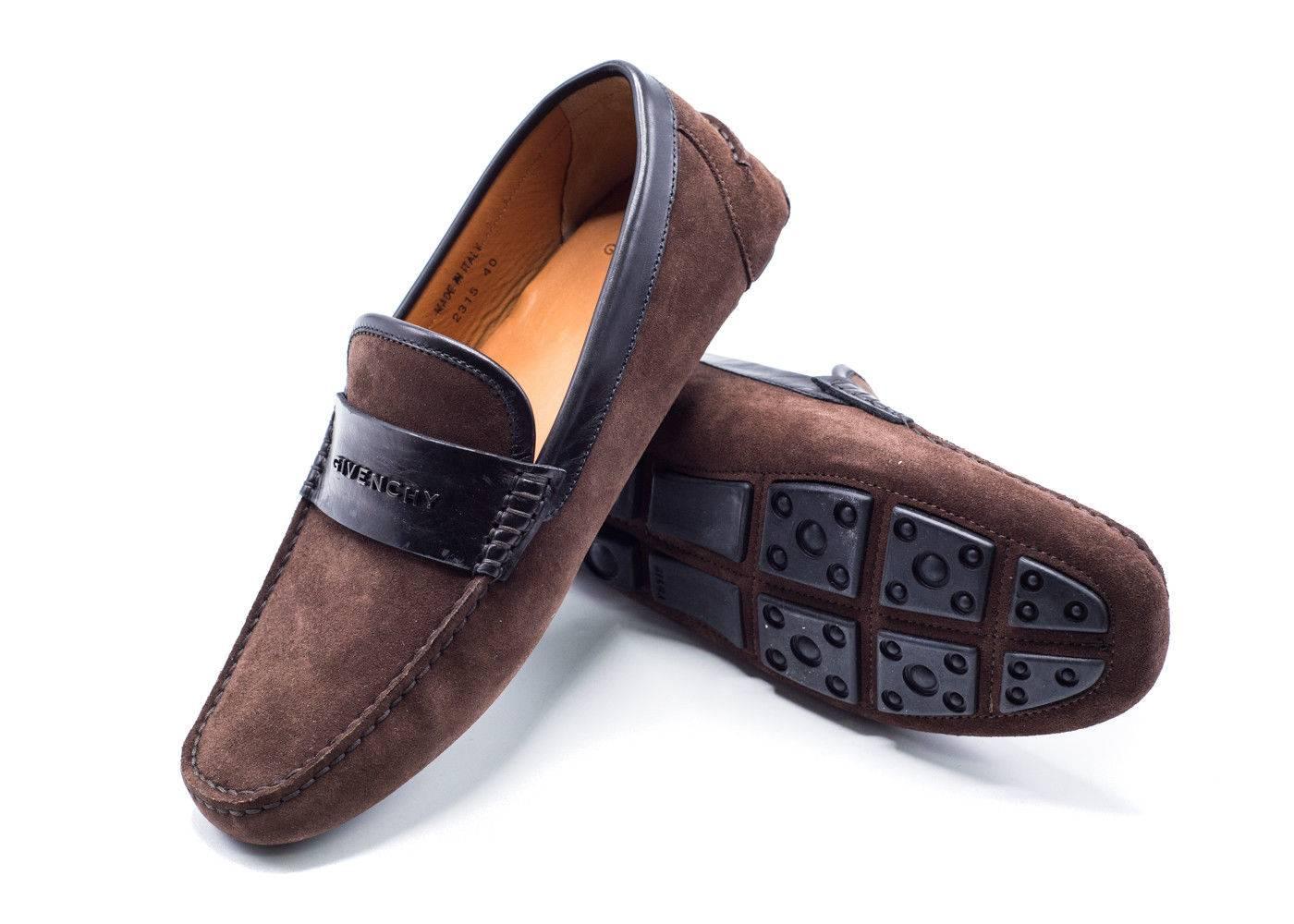 Richly made suede brown refined penny loafer styled with a stacked heel and all leather sole and insole. This Givenchy penny loafer is the perfect shoe for the every day business man. With the deep brown color on the shoes, they will make an ever