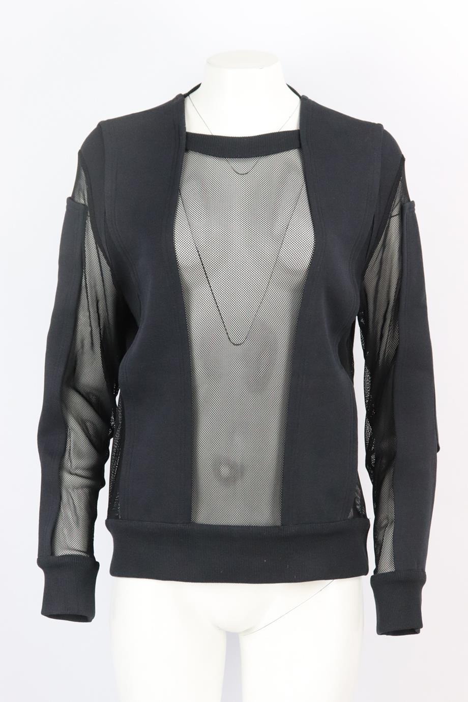 Givenchy mesh paneled cotton sweatshirt. Black. Long sleeve, crewneck. Slips on. Size: Small (UK 8, US 4, FR 36, IT 40). Bust: 41 in. Waist: 38 in. Hips: 36 in. Length: 26.5 in.. Very good condition - Composition label cut out for comfort; see
