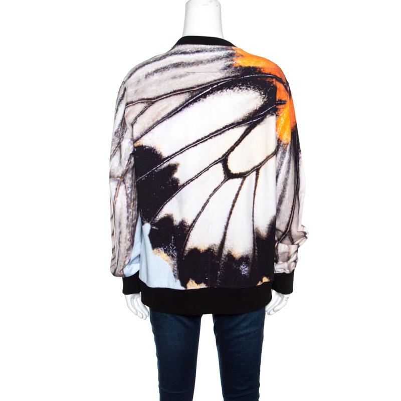 This sweatshirt from Givenchy is perfect for your casual wear. It is made from quality cotton to give you comfort and designed with butterfly wings printed all over. This creation definitely deserves a place in your closet.

Includes: Original Tags,