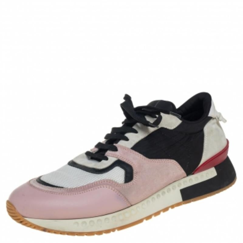 This pair of Givenchy sneakers will make a mark for themselves in your closet. Crafted from leather, suede, fabric, and mesh, they are adorned in subtle hues. They come equipped with laces, fabric lining, leather insoles, and rubber soles. The