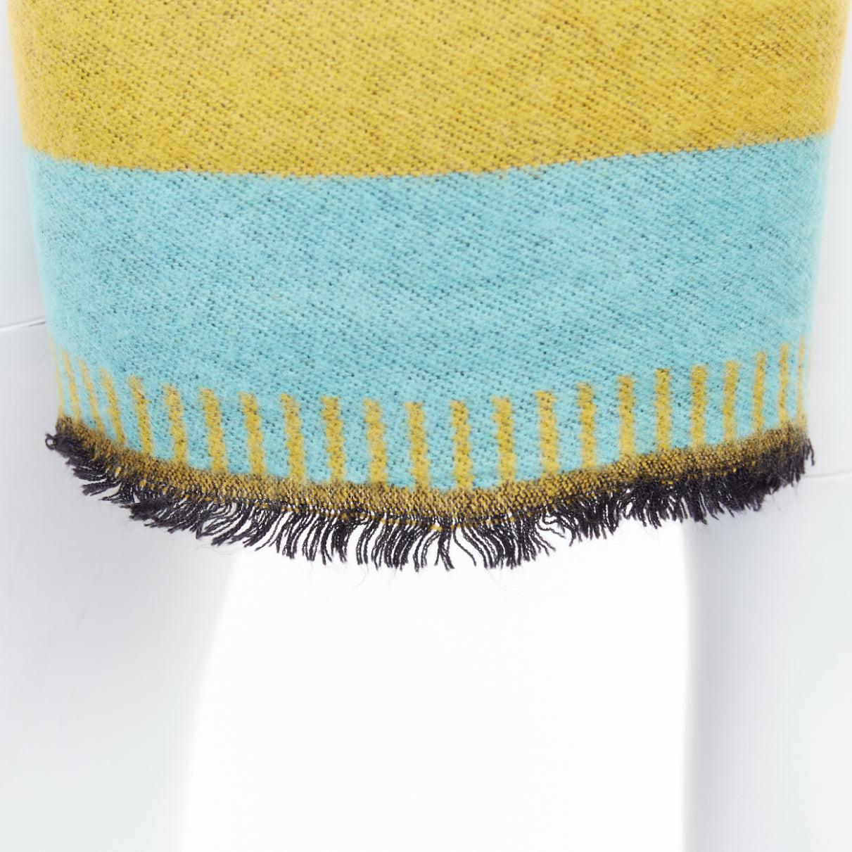 GIVENCHY mustard mint green wooly black fringe big logo long scarf
Reference: JACG/A00284
Brand: Givenchy
Material: Feels like wool
Color: Green
Pattern: Solid

CONDITION:
Condition: Very good, this item was pre-owned and is in very good condition. 