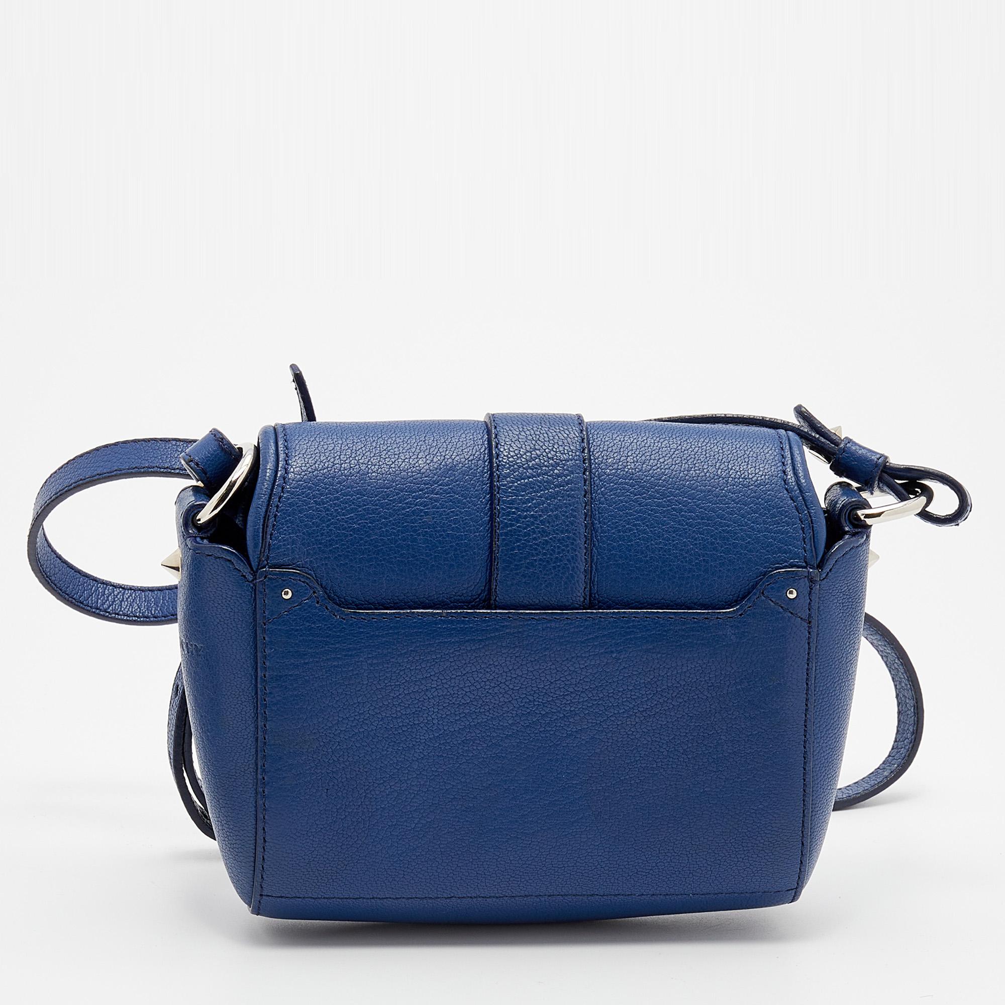 This gorgeous shoulder bag comes from the House of Givenchy. It is crafted from navy-blue leather on the exterior. It features a shoulder strap, silver-toned hardware, and a fabric-lined interior. This stunning creation is ideal for everyday use.

