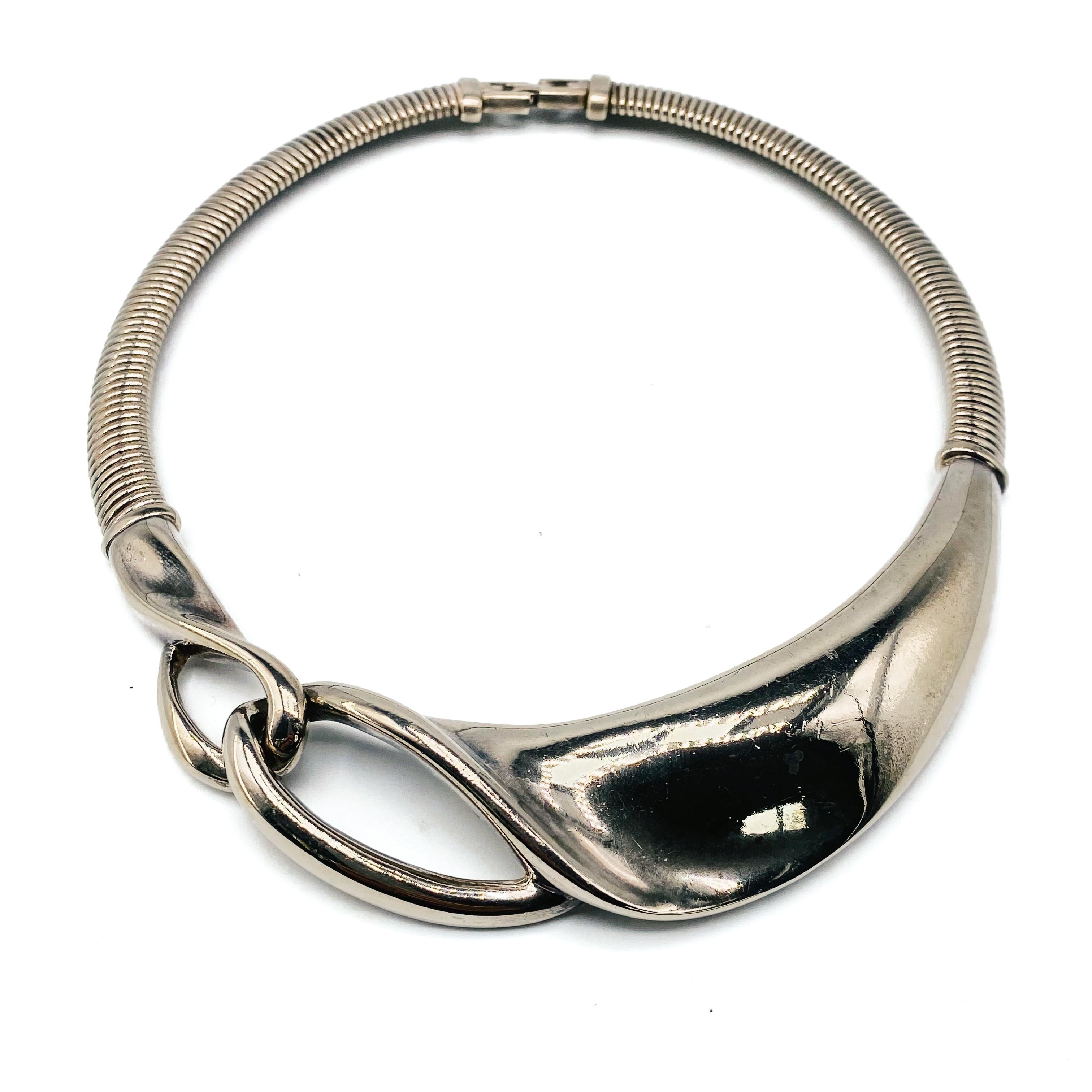 Givenchy Vintage 1980s Collar Necklace

Amazing modernist statement necklace from the iconic house of Hubert de Givenchy. Crafted in the early 80s from silver plated metal. Features a large abstract centrepiece within a chunky articulates snake