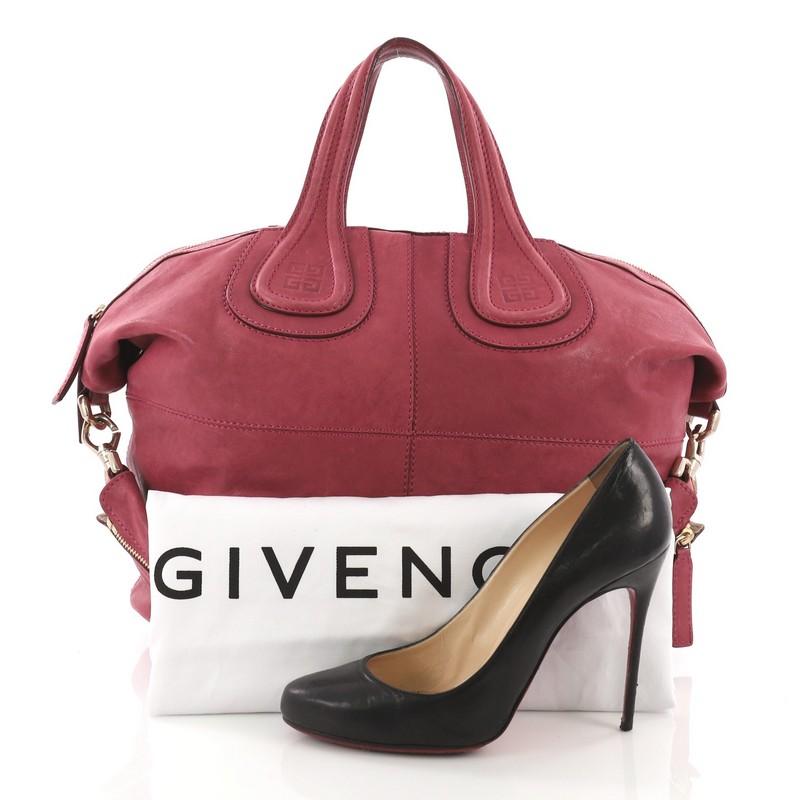 This Givenchy Nightingale Satchel Leather Medium, crafted from dark pink leather, features an embossed Givenchy logo at its handles and gold-tone hardware. Its zip closure opens to a beige fabric interior with zip and slip pockets. **Note: Shoe