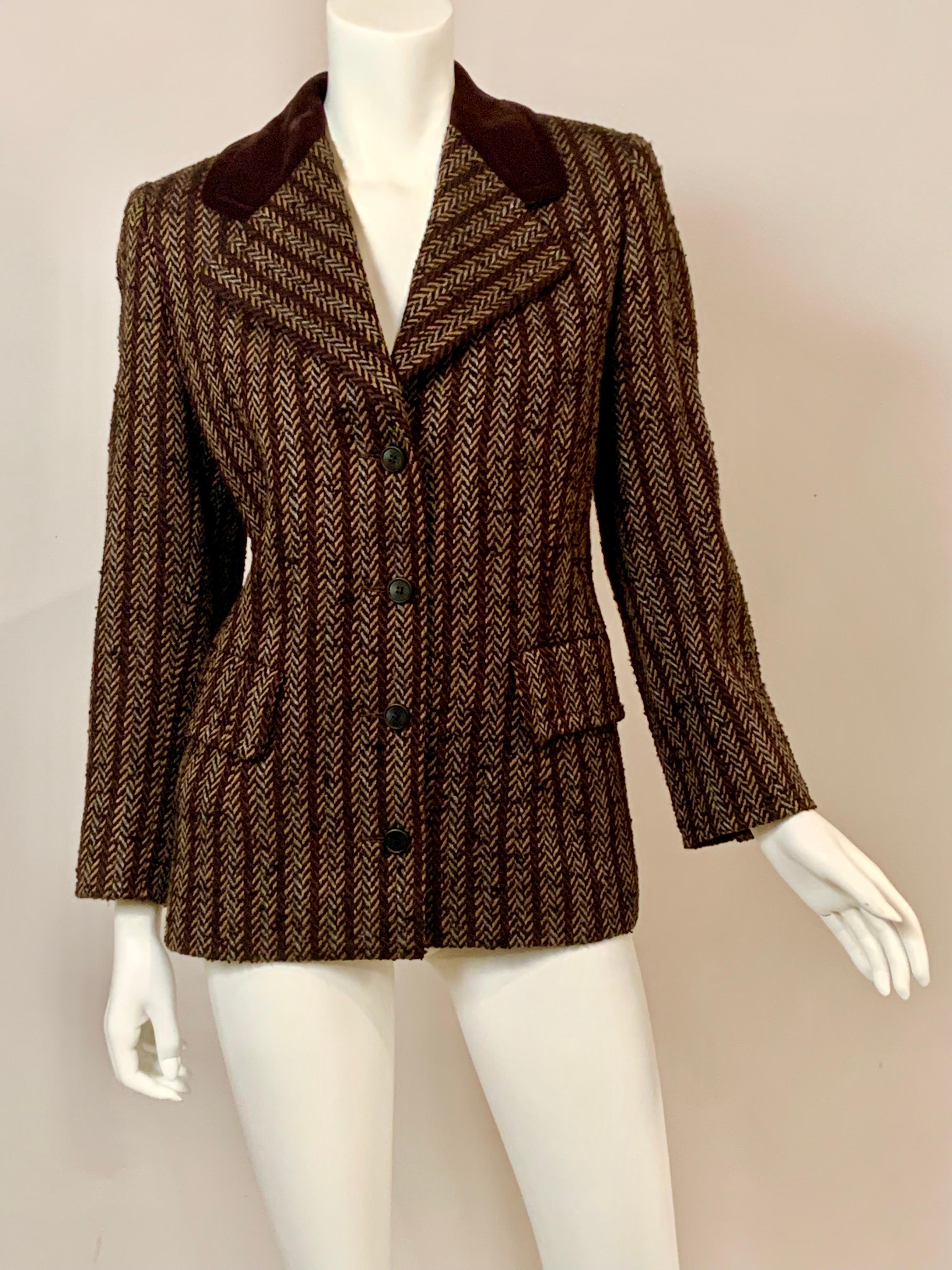 This classic Hubert de Givenchy designed wool blazer has a chocolate brown velvet collar and an unusual nubby wool herringbone fabric that was woven with four colors instead of the usual two colors.  The fabric is chocolate brown, copper, black and
