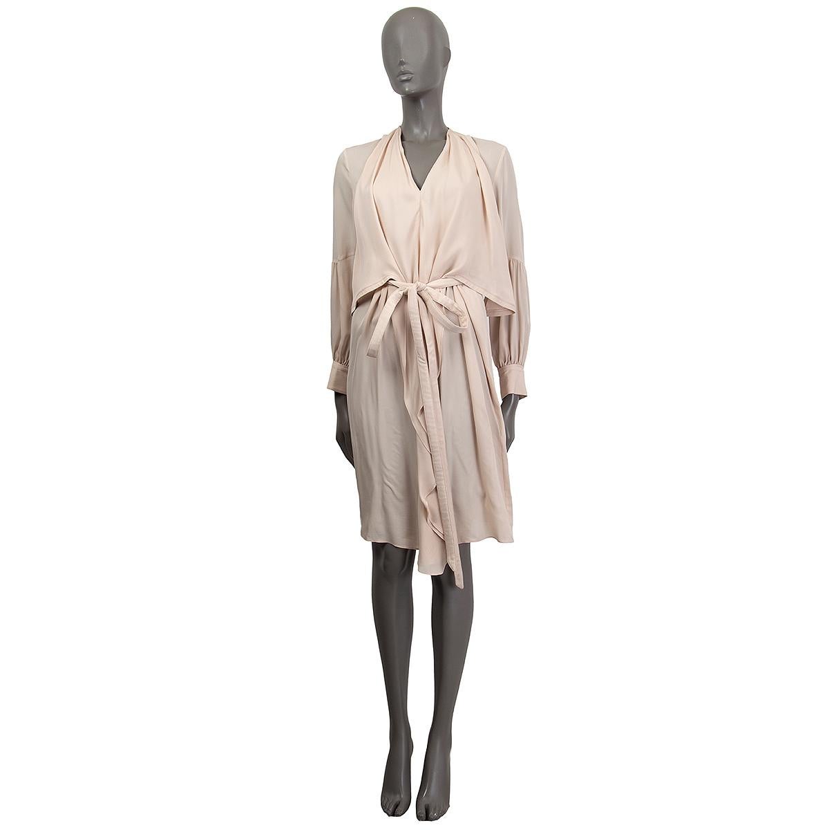 100% authentic Givenchy long sleeve front drape dress in nude silk (100%) with a v-neck. Comes with a matching belt. Cuffs fasten with a button. Unlined. Slight pulling on fabric around the v-neck area, otherwise it is in overall good