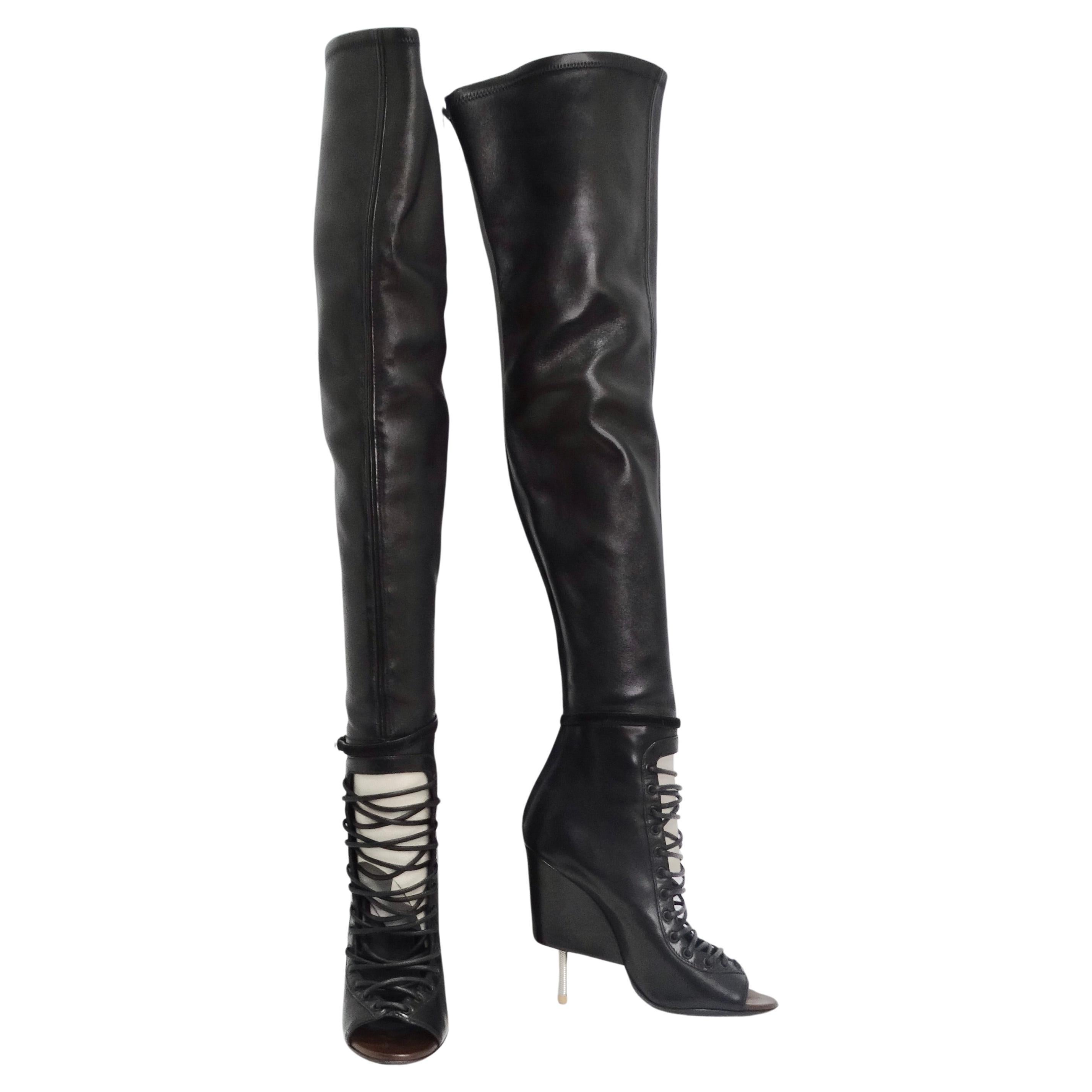 Do not miss out on the Givenchy Nunka Leather Thigh High Boots in Black – a true embodiment of iconic and fearless fashion. These boots redefine the boundaries of statement footwear with their over-the-knee design, featuring an open toe and a