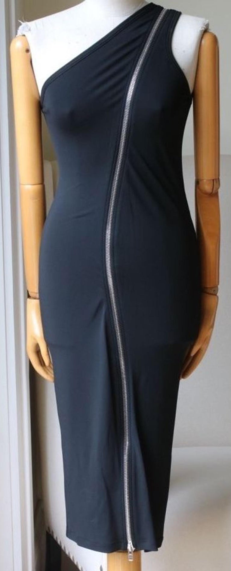 Made from stretch-jersey, this midi dress is detailed with an asymmetric silver one through the front and back that traces the slim one-shoulder silhouette. Black stretch-jersey. One shoulder, asymmetric two-way zip through front and back. Slips on.
