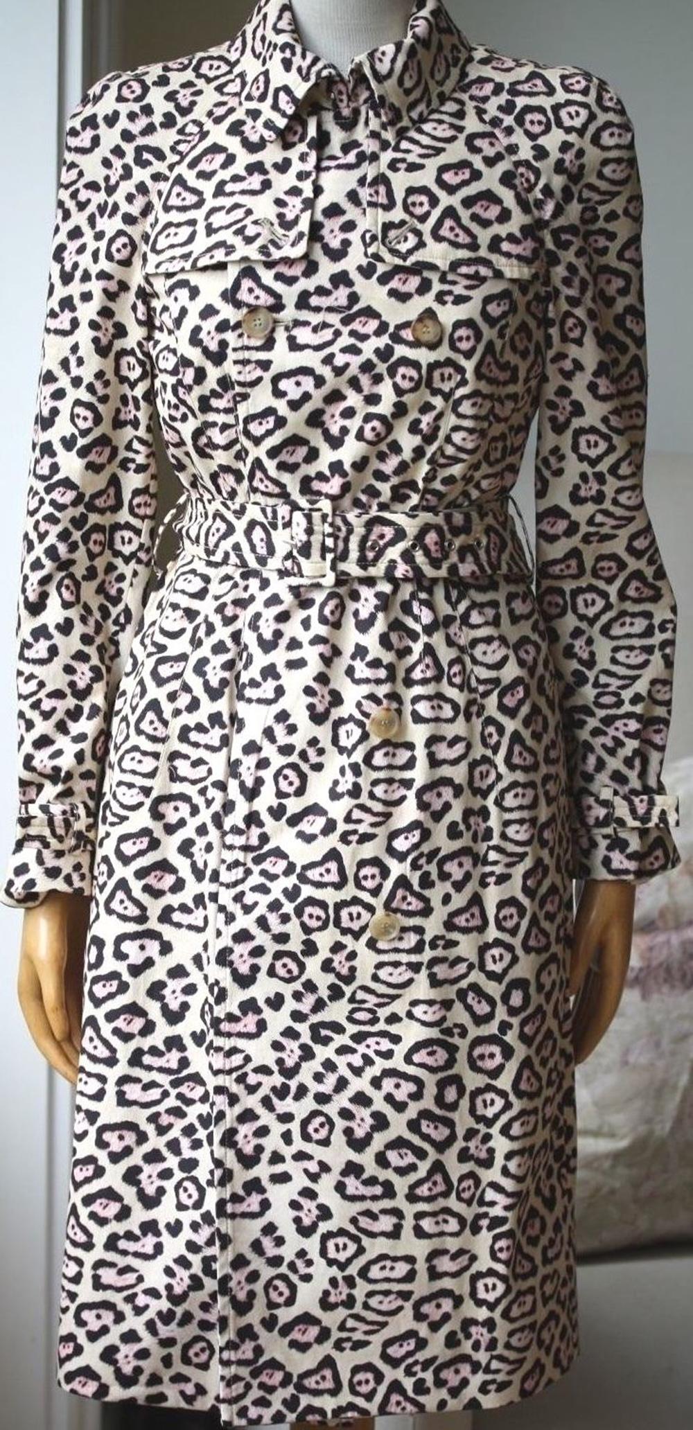 Beige, black and pink oversize leopard print coat from Givenchy featuring a drawstring hood, a concealed zip fastening, short wide sleeves, front flap pockets and a straight hem. 100% polyamide, 53% acrylic, 47% polyester, lining: 100% polyamide.
