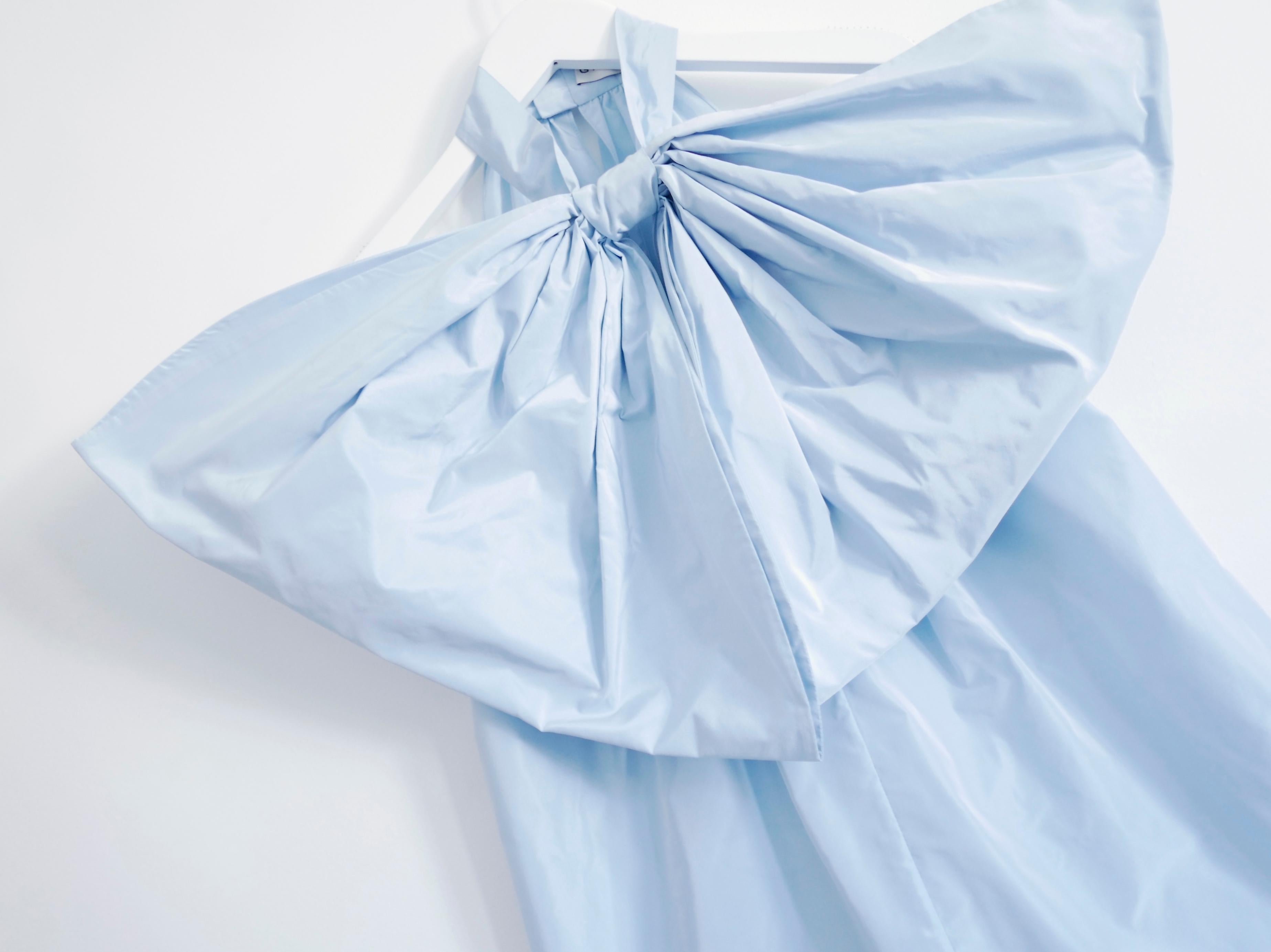 Stunning Givenchy pale blue exaggerated bow blouse. New with tag. Very Bella Baxter from Poor Things. Made from soft yet crisp cotton/polyester taffeta, it has a sleeveless cut with extra large bow tie at the neck and soft gathering at the back.