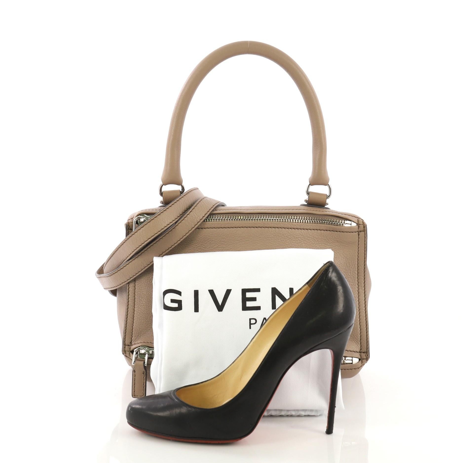 This Givenchy Pandora Bag Leather Small, crafted from taupe leather, features a rolled top handle, Givenchy logo at the center, and silver-tone hardware. Its two-way zip fastenings open to a beige fabric interior with side zip and slip pockets.