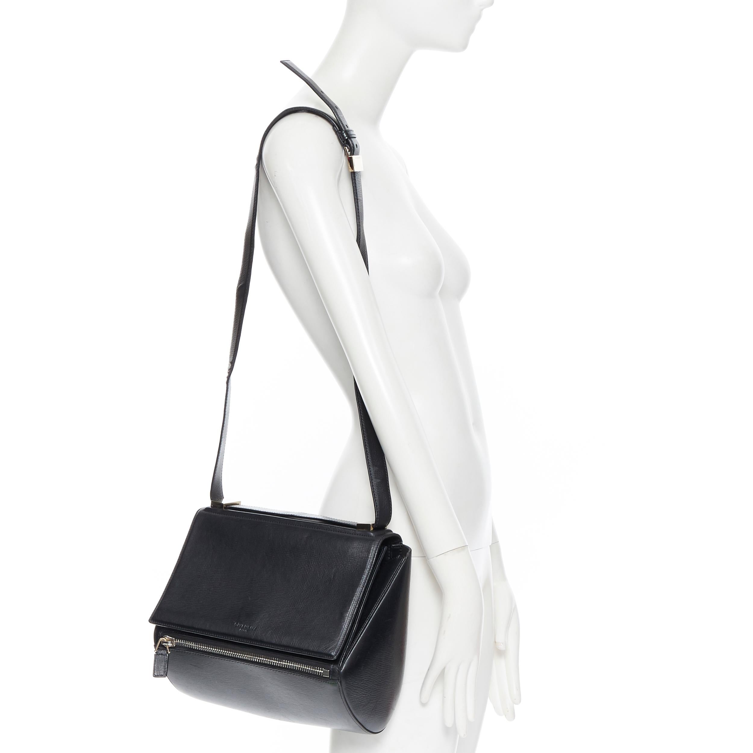 GIVENCHY Pandora Box black leather flap front zip structured crossbody bag
Brand: Givenchy
Model Name / Style: Pandora Box
Material: Leather
Color: Black
Pattern: Solid
Closure: Clasp
Extra Detail: Concealed push clasp flap front. Front zipper